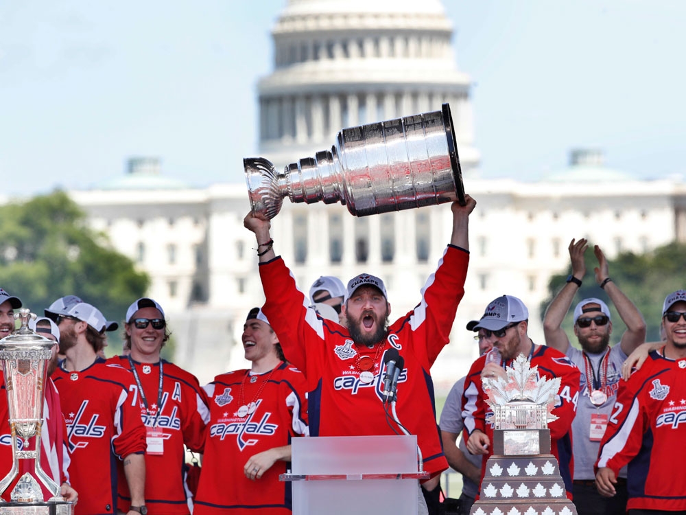 Washington Capitals' Alex Ovechkin holds up the Stanley Cup trophy during the NHL hockey team's victory celebration on June 12, 2018 Washington Capitals' Alex Ovechkin holds up the Stanley Cup trophy during the NHL hockey team's victory celebration on June 12, 2018