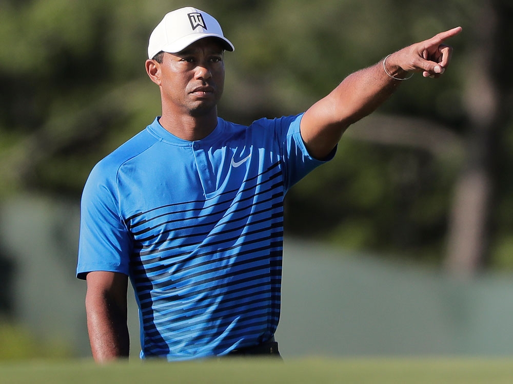 Tiger Woods motions while chipping onto the third green during a practice round for the U.S. Open Golf Championship on June 12, 2018, in Southampton, N.Y. Tiger Woods motions while chipping onto the third green during a practice round for the U.S. Open Golf Championship on June 12, 2018, in Southampton, N.Y.