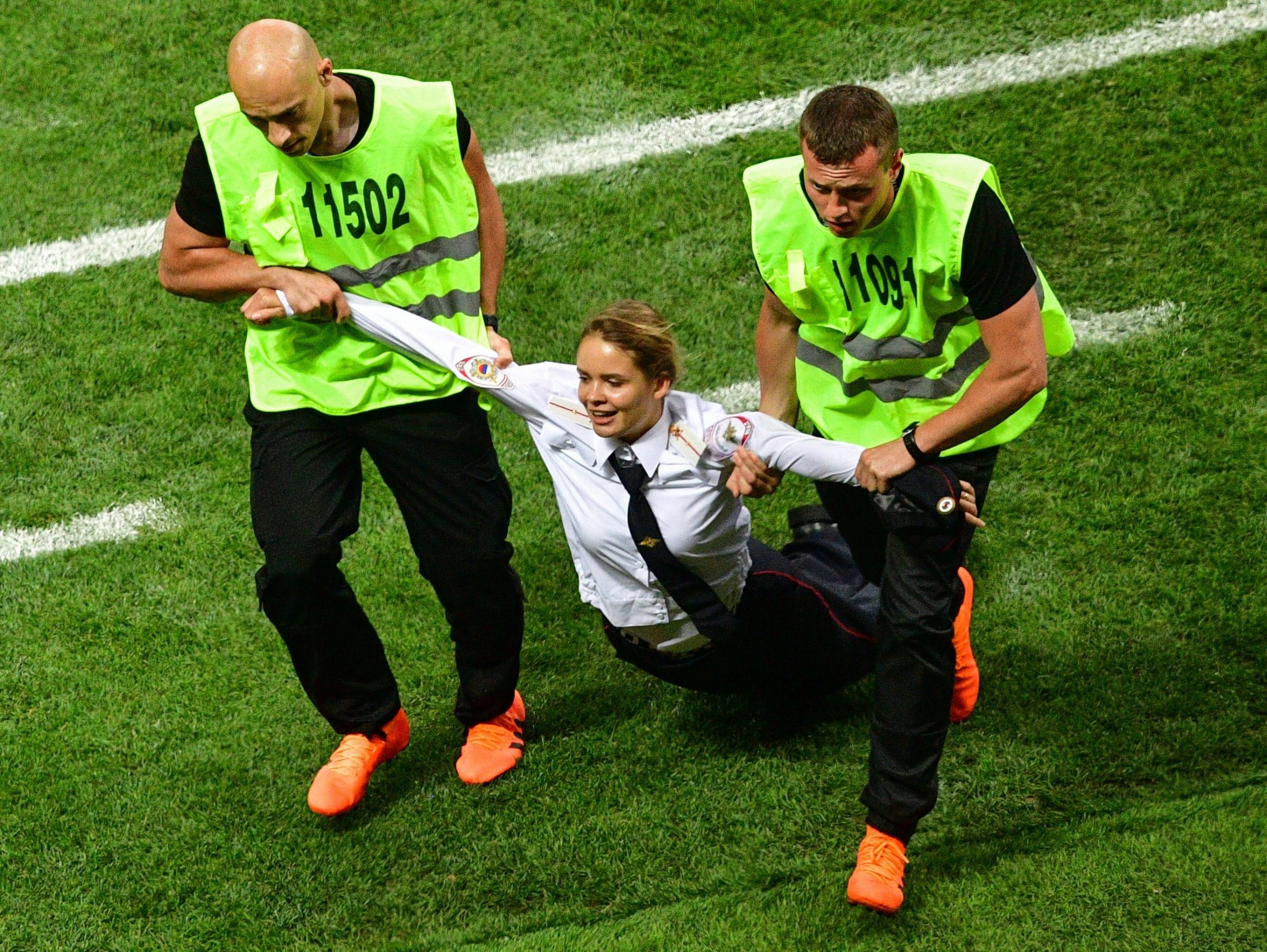 A pitch invader, a member of the Russian protest-art group Pussy Riot, is escorted by stewards during the Russia 2018 World Cup final football match between France and Croatia at the Luzhniki Stadium in Moscow on July 15, 2018. (Mladen Antonov/Getty Images) A pitch invader, a member of the Russian protest-art group Pussy Riot, is escorted by stewards during the Russia 2018 World Cup final football match between France and Croatia at the Luzhniki Stadium in Moscow on July 15, 2018. (Mladen Antonov/Getty Images)