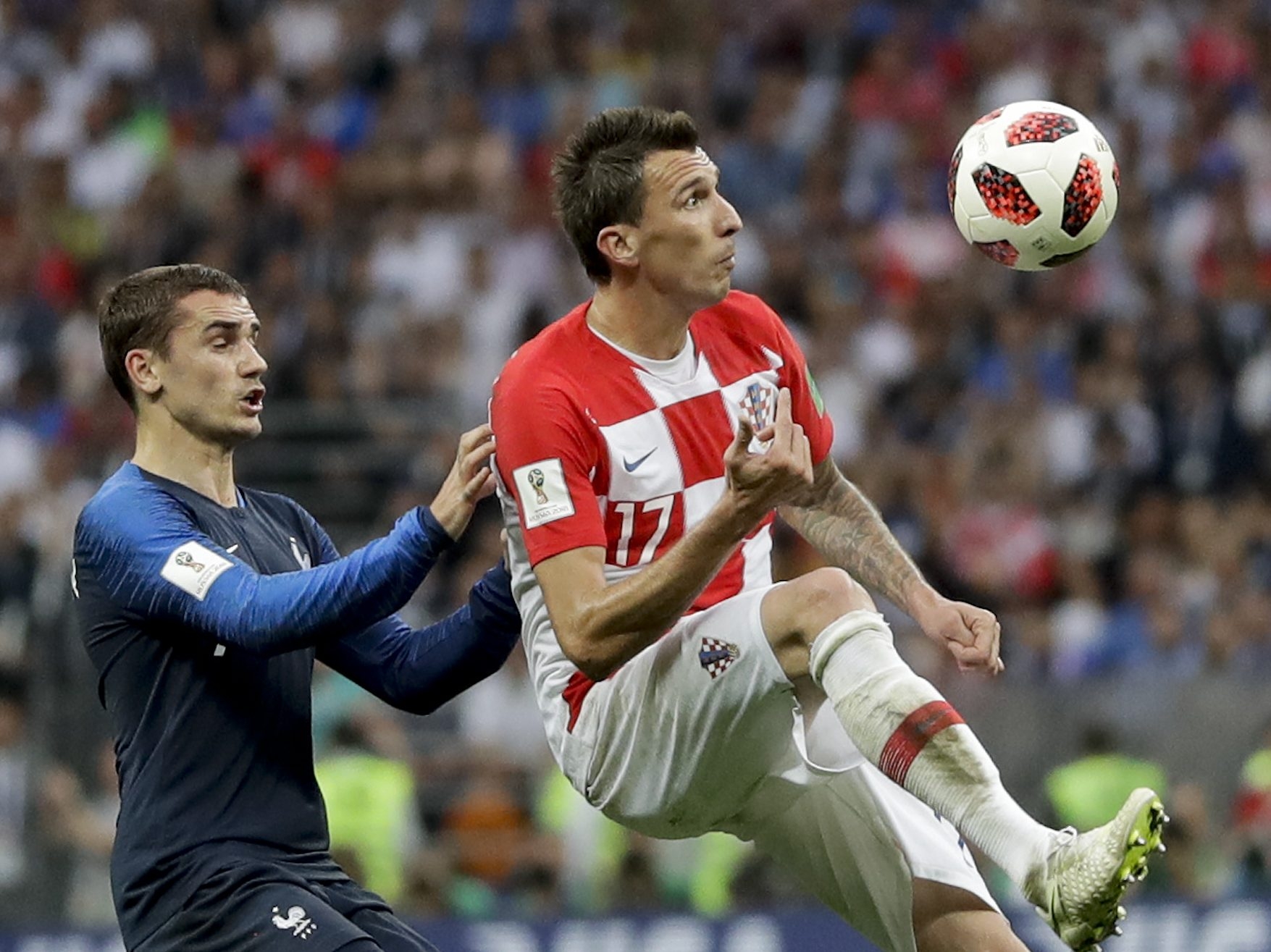  Croatia’s Mario Mandzukic, right, vies for the ball with France’s Antoine Griezmann, left, during the final match between France and Croatia at the 2018 soccer World Cup in the Luzhniki Stadium in Moscow, Russia, Sunday, July 15, 2018. (AP Photo/Matthias Schrader)