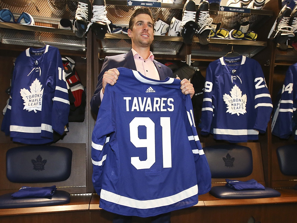 Toronto Maple Leafs forward John Tavares stands at his stall in the locker room with his new jersey. (Jack Boland/Toronto Sun) Toronto Maple Leafs forward John Tavares stands at his stall in the locker room with his new jersey. (Jack Boland/Toronto Sun)