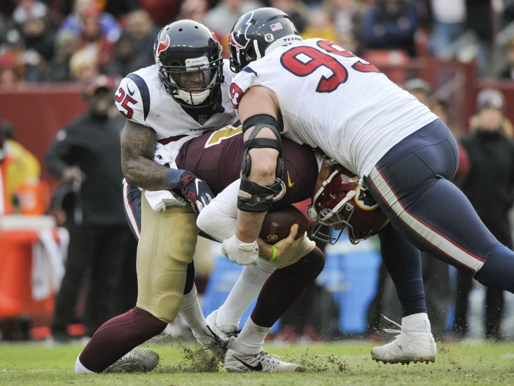 Redskins quarterback Alex Smith broke his ankle while being sacked by Texans defensive end J.J. Watt and strong safety Kareem Jackson during NFL action Nov. 18, 2018 in Landover, Md. Redskins quarterback Alex Smith broke his ankle while being sacked by Texans defensive end J.J. Watt and strong safety Kareem Jackson during NFL action Nov. 18, 2018 in Landover, Md.