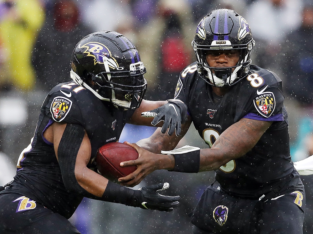 Baltimore Ravens quarterback Lamar Jackson looks to hand off the ball to Mark Ingram II against the San Francisco 49ers at M&T Bank Stadium on December 1, 2019 in Baltimore. (Patrick Smith/Getty Images) Baltimore Ravens quarterback Lamar Jackson looks to hand off the ball to Mark Ingram II against the San Francisco 49ers at M&T Bank Stadium on December 1, 2019 in Baltimore. (Patrick Smith/Getty Images)