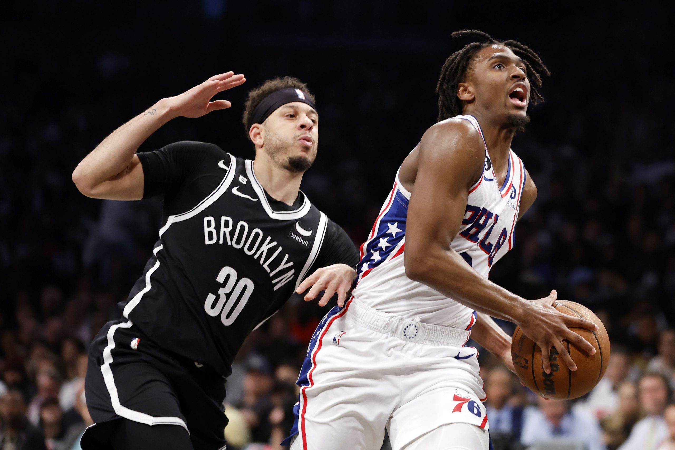 Tyrese Maxey #0 of the Philadelphia 76ers goes to the basket as Seth Curry #30 of the Brooklyn Nets defends during the second half of Game Four of the Eastern Conference First Round Playoffs at Barclays Center on April 22, 2023 in the Brooklyn borough of New York City. The 76ers won 96-88. 