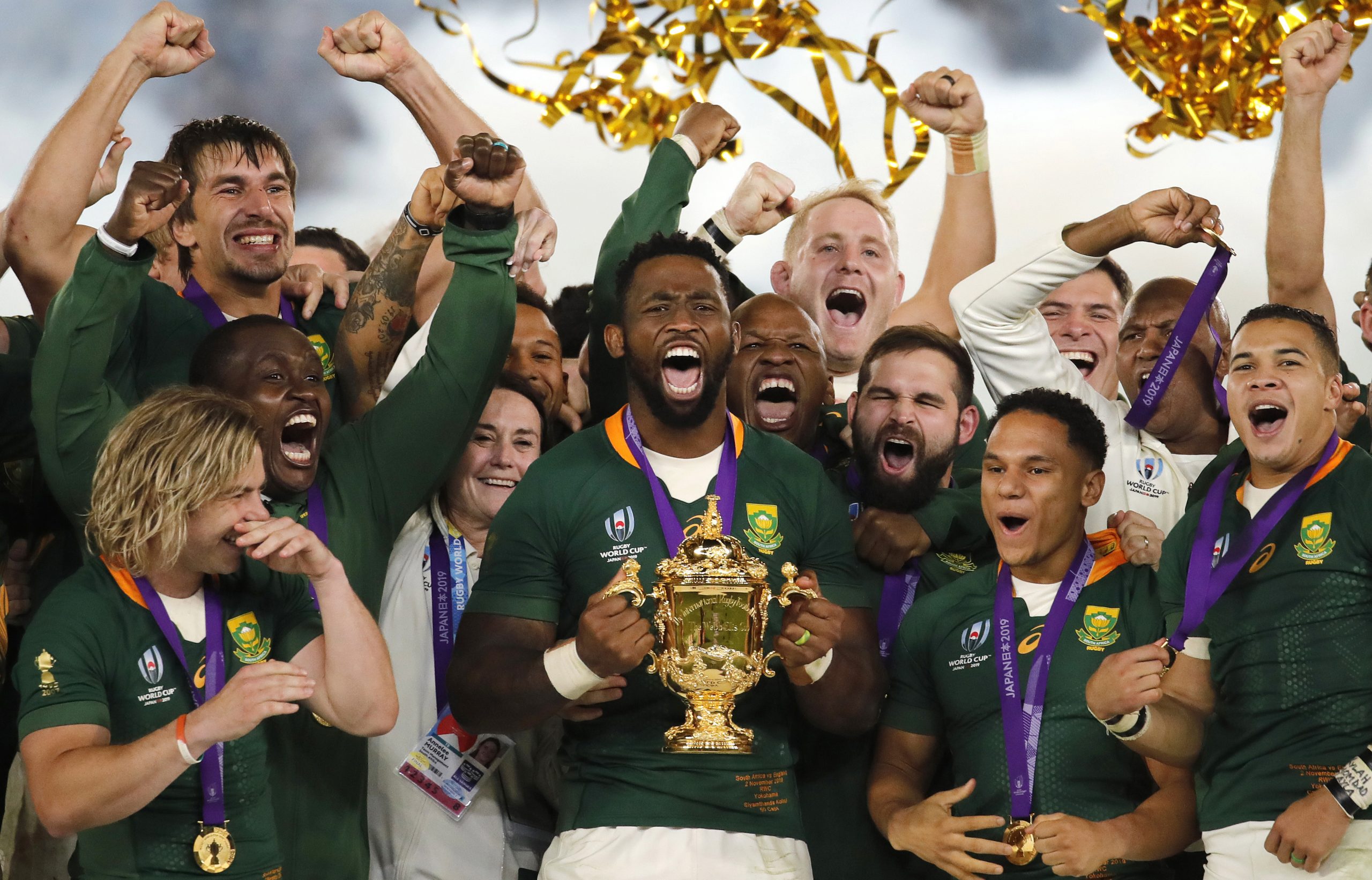 South African captain Siya Kolisi holds the Webb Ellis Cup aloft after South Africa defeated England to win the Rugby World Cup final.