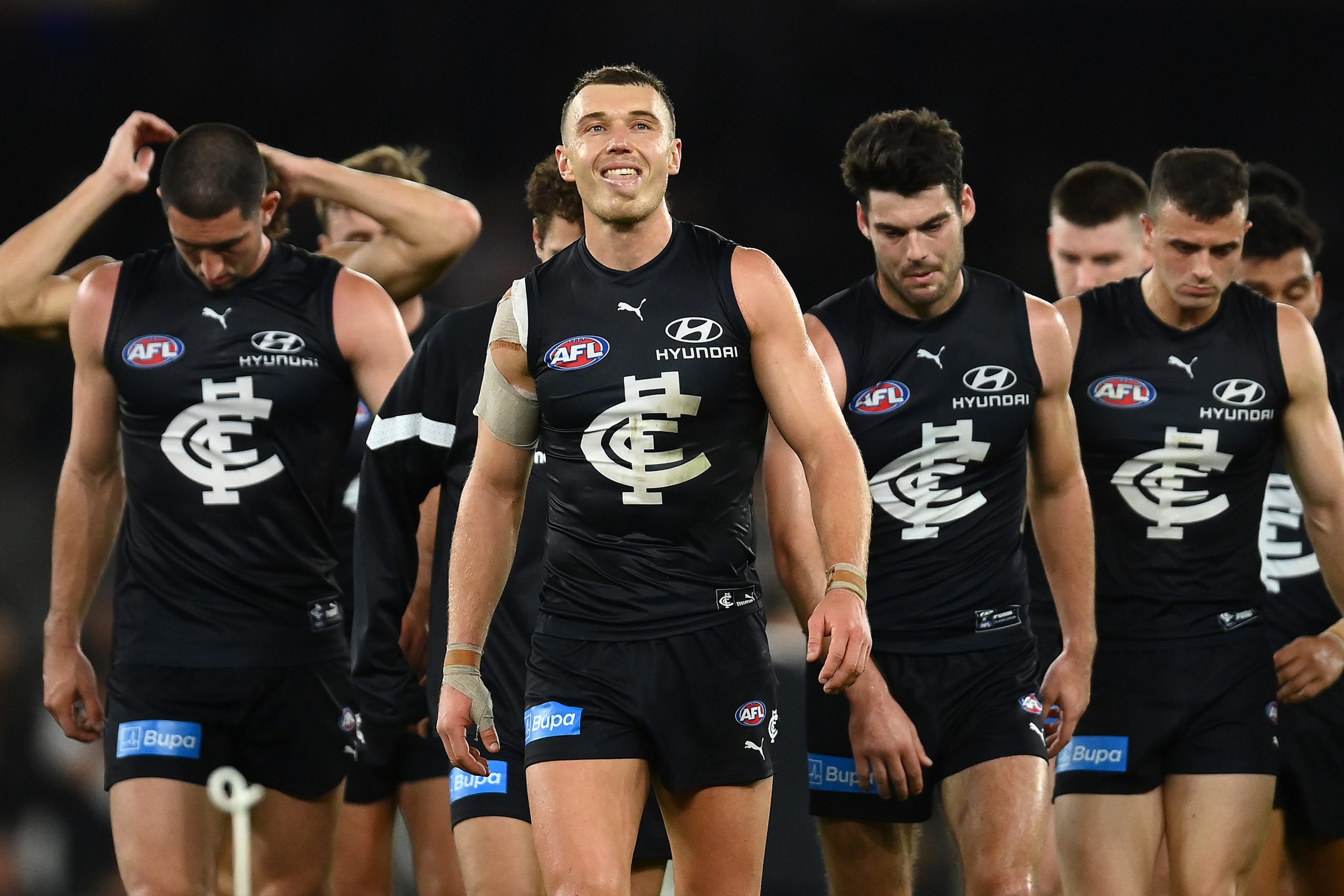 MELBOURNE, AUSTRALIA - APRIL 23: Patrick Cripps and his Blues team mates look dejected after losing the round six AFL match between Carlton Blues and St Kilda Saints at Marvel Stadium, on April 23, 2023, in Melbourne, Australia. (Photo by Quinn Rooney/Getty Images)