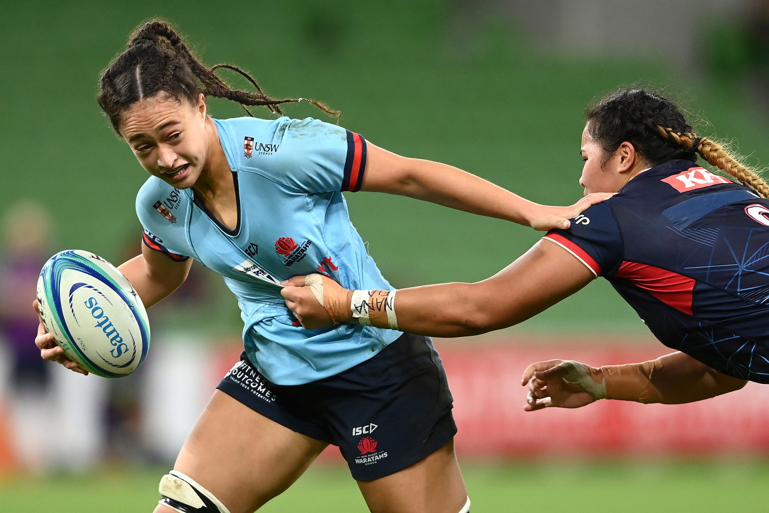 Leilani Nathan of the Waratahs is tackled at AAMI Park.