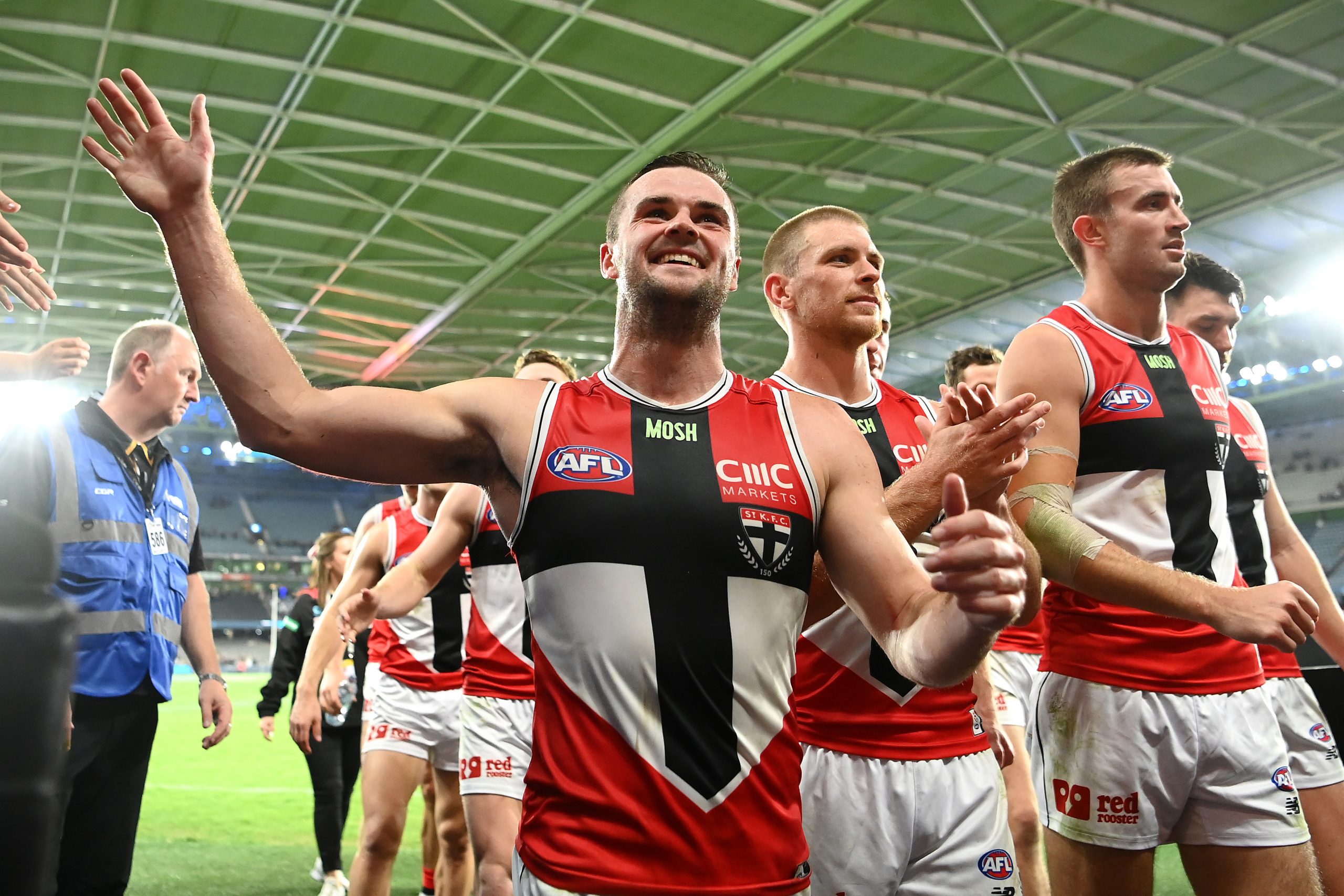MELBOURNE, AUSTRALIA - APRIL 23: Brad Crouch of the Saints  high fives fans after winning the round six AFL match between Carlton Blues and St Kilda Saints at Marvel Stadium, on April 23, 2023, in Melbourne, Australia. (Photo by Quinn Rooney/Getty Images)