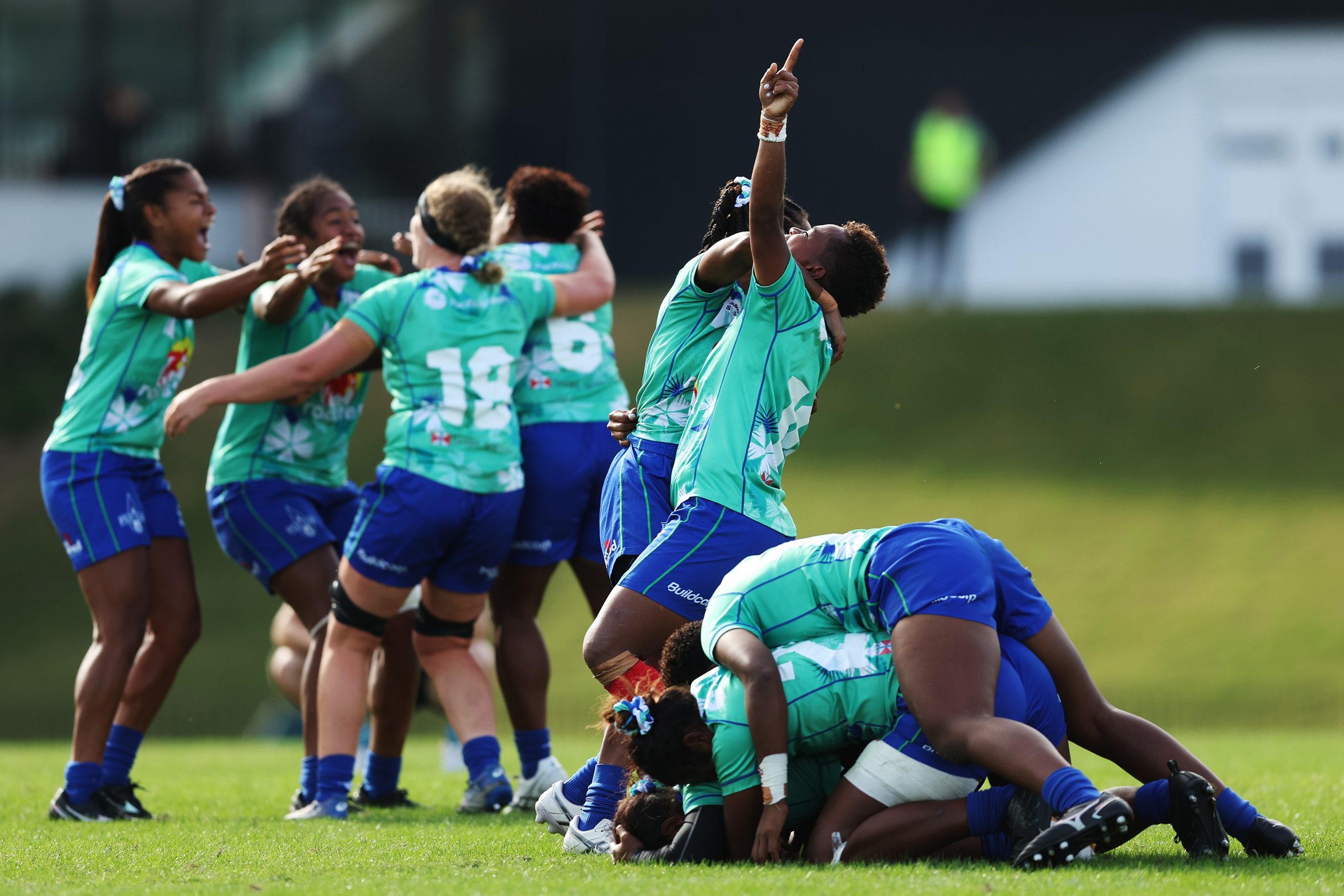 Drua players celebrate victory on the final whistle.