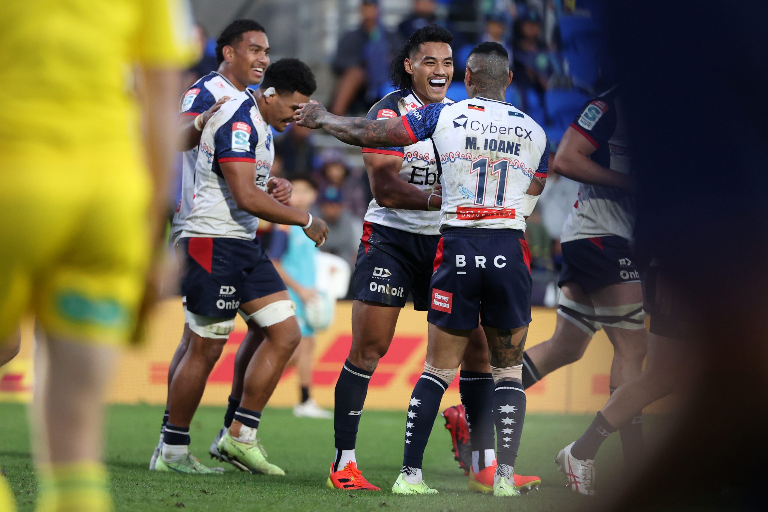 David Feliuai of the Rebels scores a try.