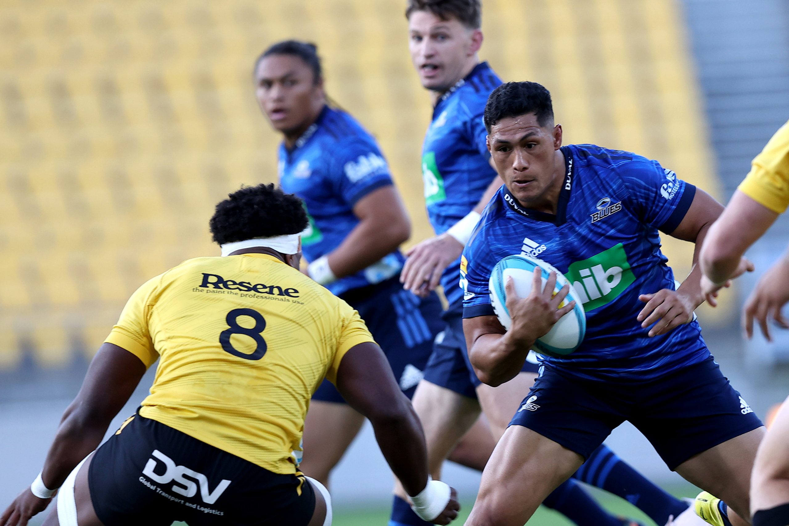 Roger Tuivasa-Sheck runs the ball for the Blues against the Hurricanes.