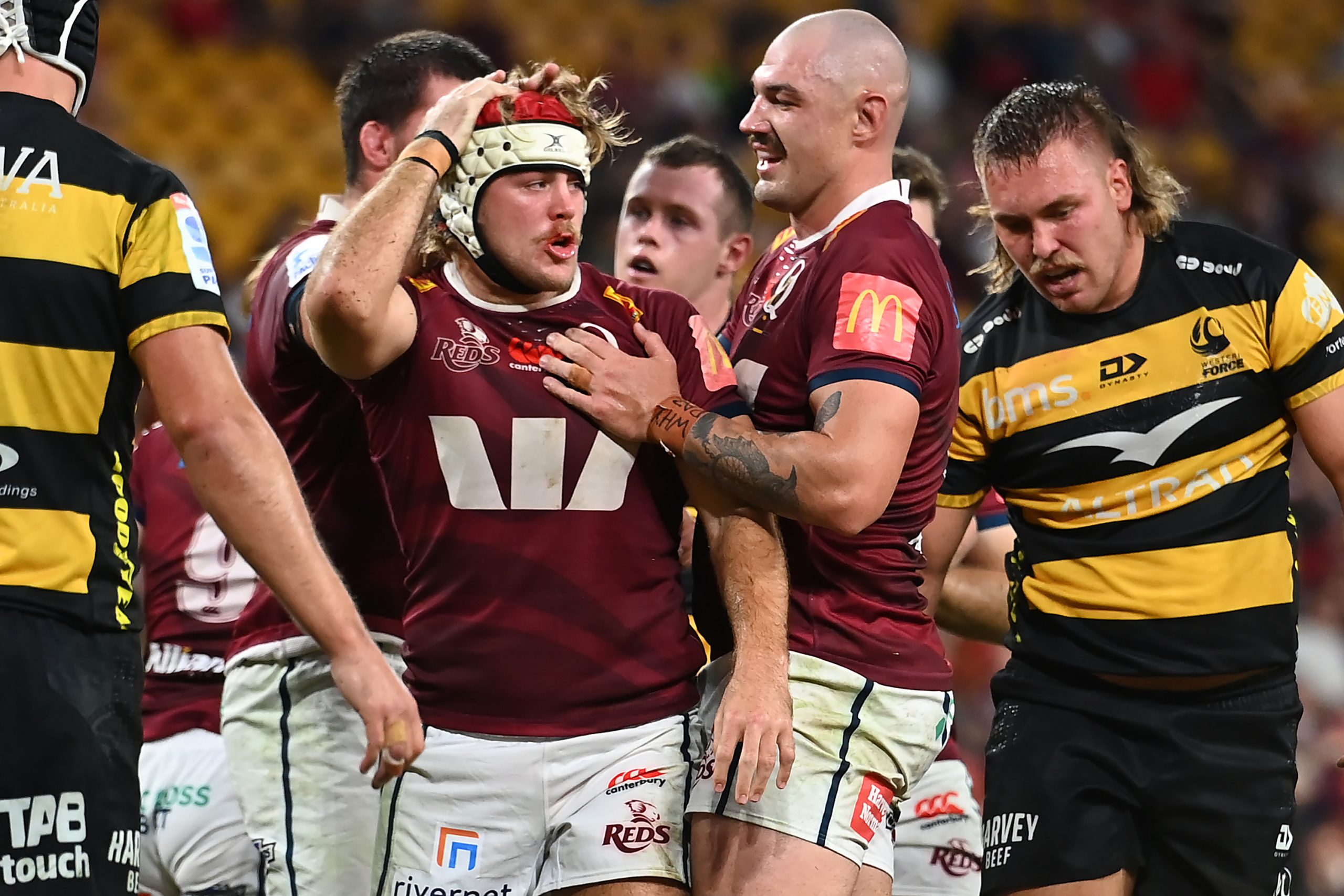 Fraser McReight of the Reds celebrates scoring a try.