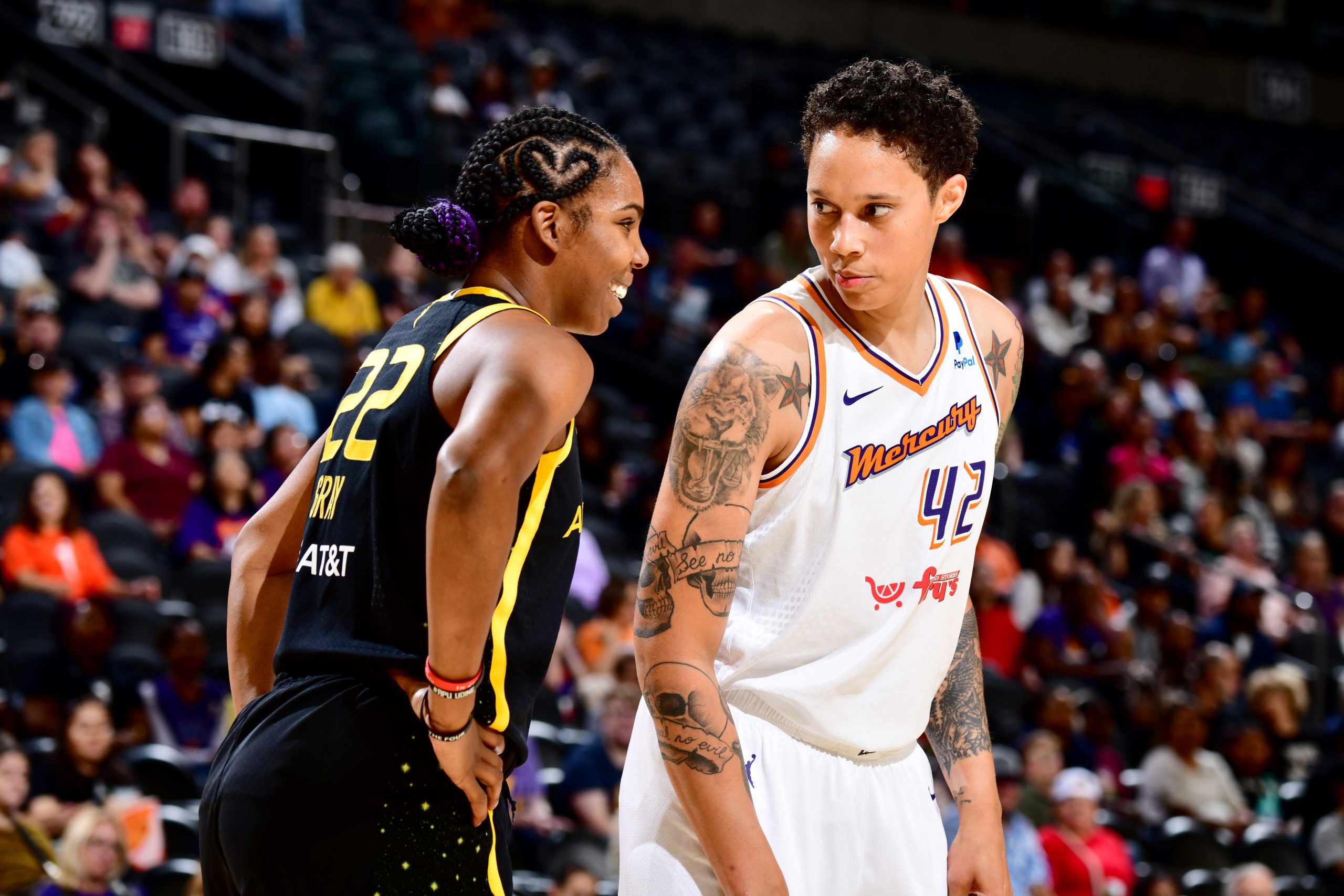 Reshanda Gray #22 of the Los Angeles Sparks and Brittney Griner #42 of the Phoenix Mercury look on during the game on May 12, 2023 at Footprint Center in Phoenix, Arizona.