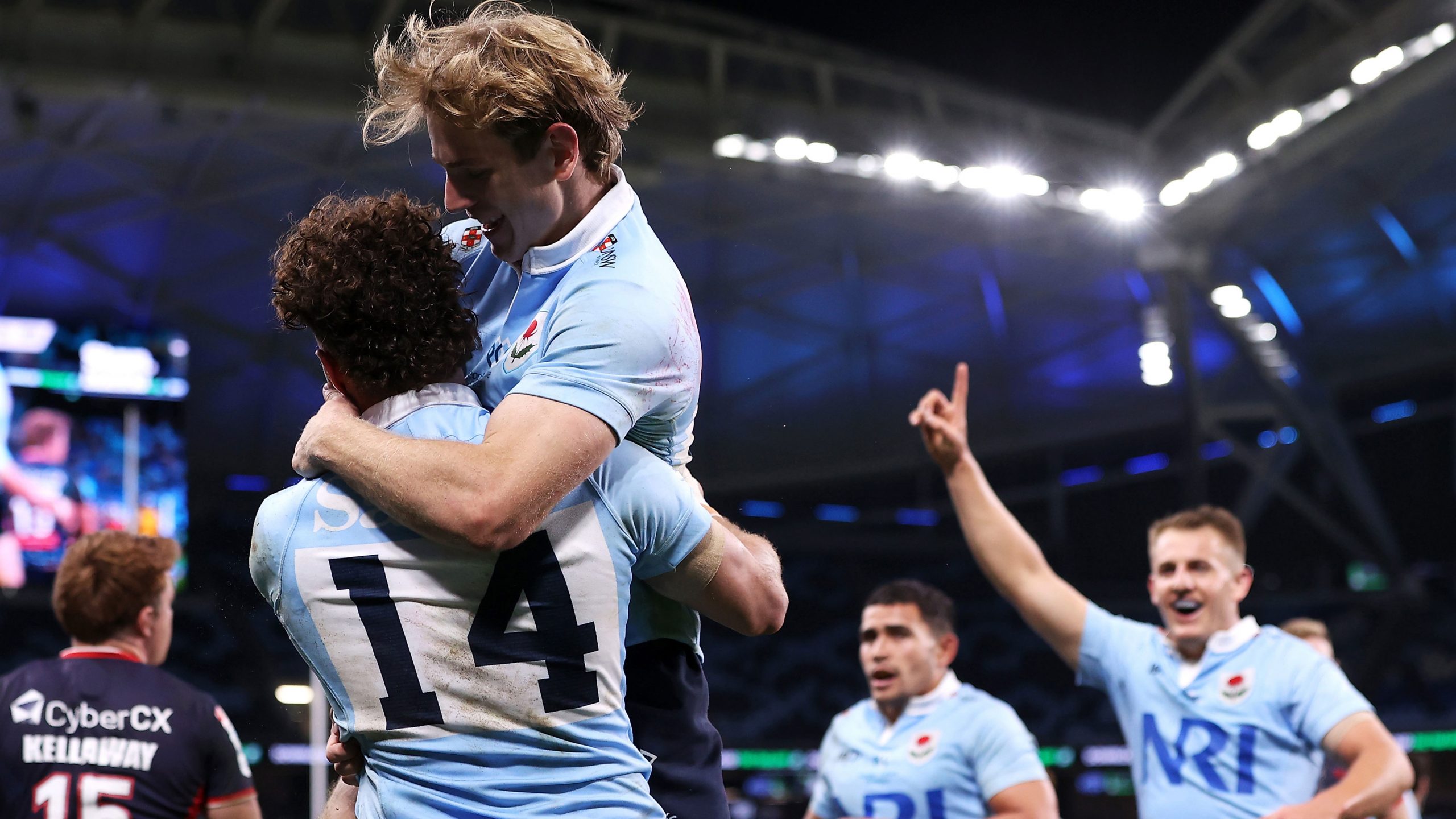 Mark Nawaqanitawase of the Waratahs celebrates with Max Jorgensen after scoring a try during their round 12 Super Rugby Pacific clash with the Melbourne Rebels.