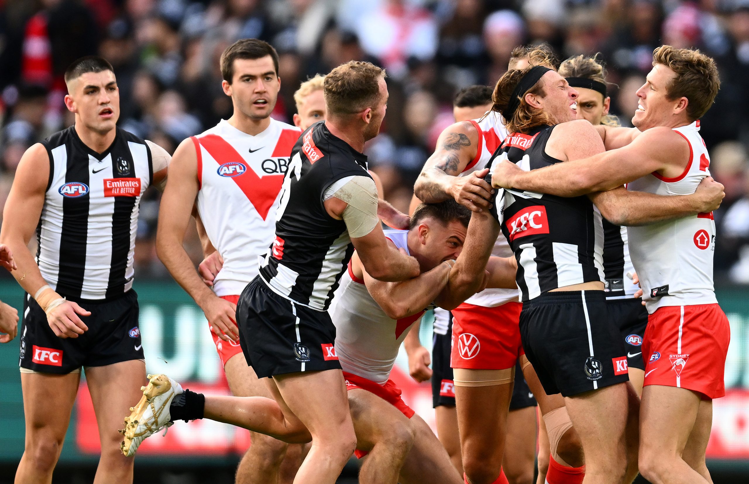 MELBOURNE, AUSTRALIA - MAY 07: Players wrestle during the round eight AFL match between Collingwood Magpies and Sydney Swans at Melbourne Cricket Ground, on May 07, 2023, in Melbourne, Australia. (Photo by Quinn Rooney/Getty Images)