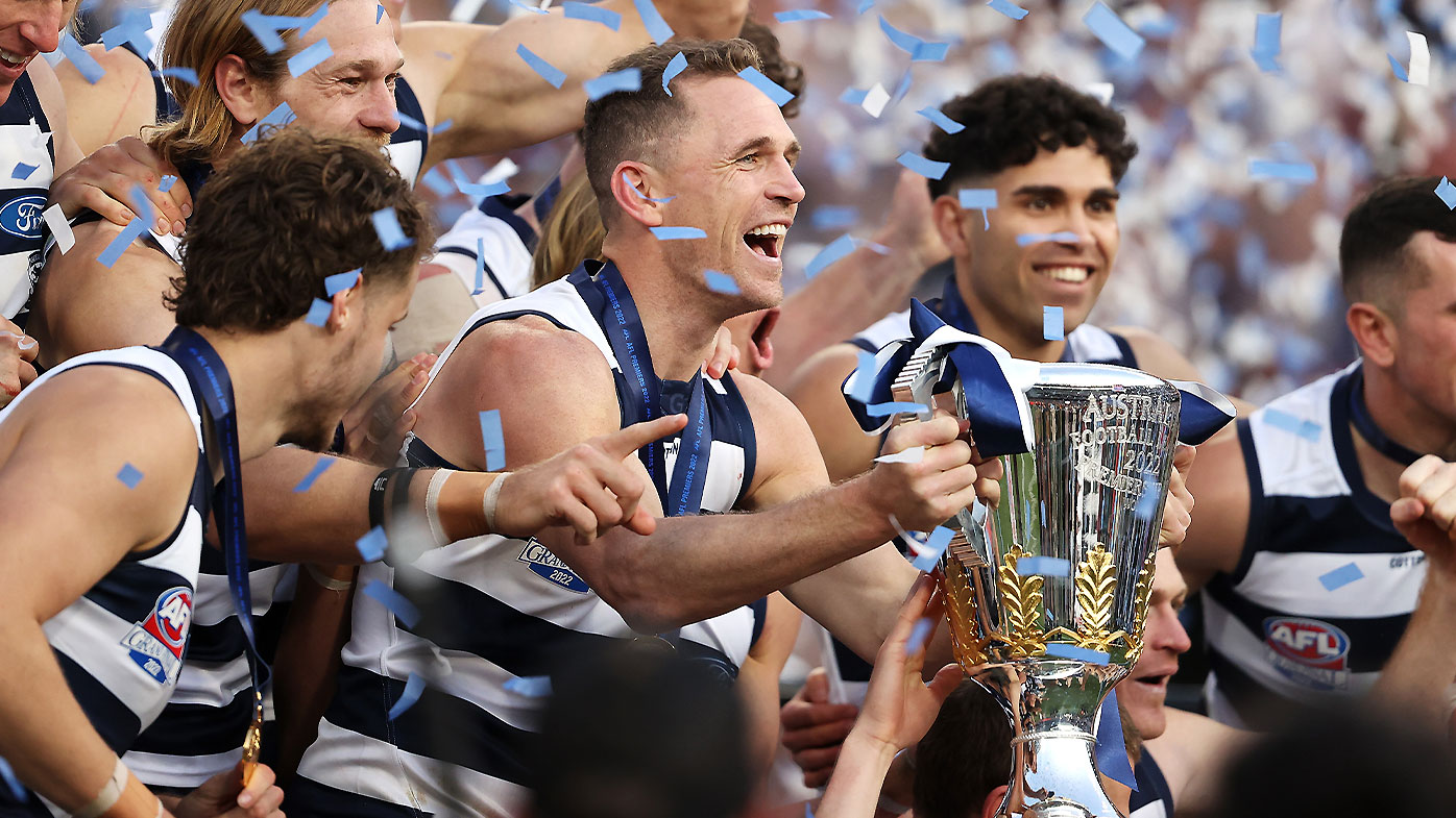 Geelong captain Joel Selwood lifts the premiership cup