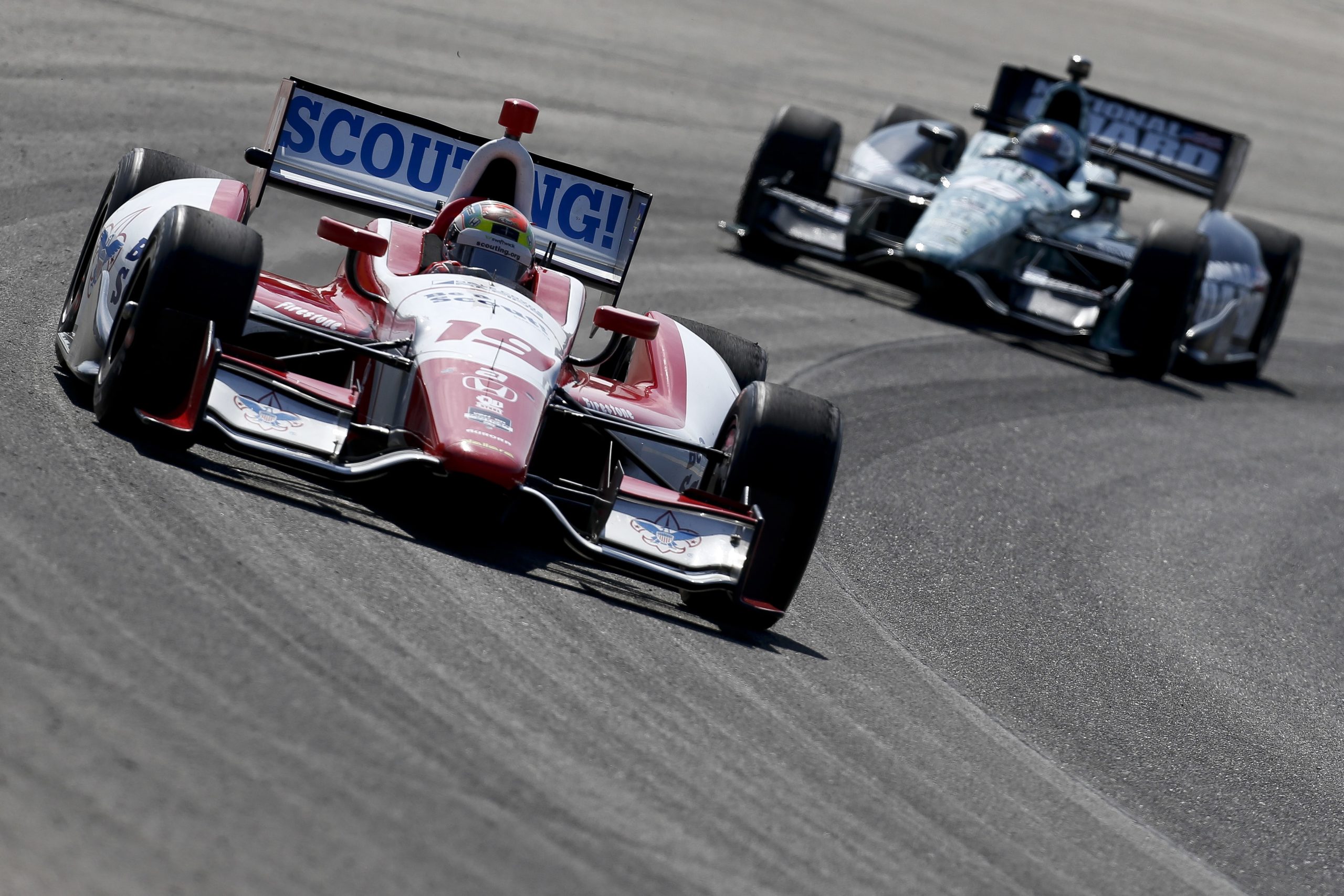 Justin Wilson of England leads Graham Rahal in 2014.