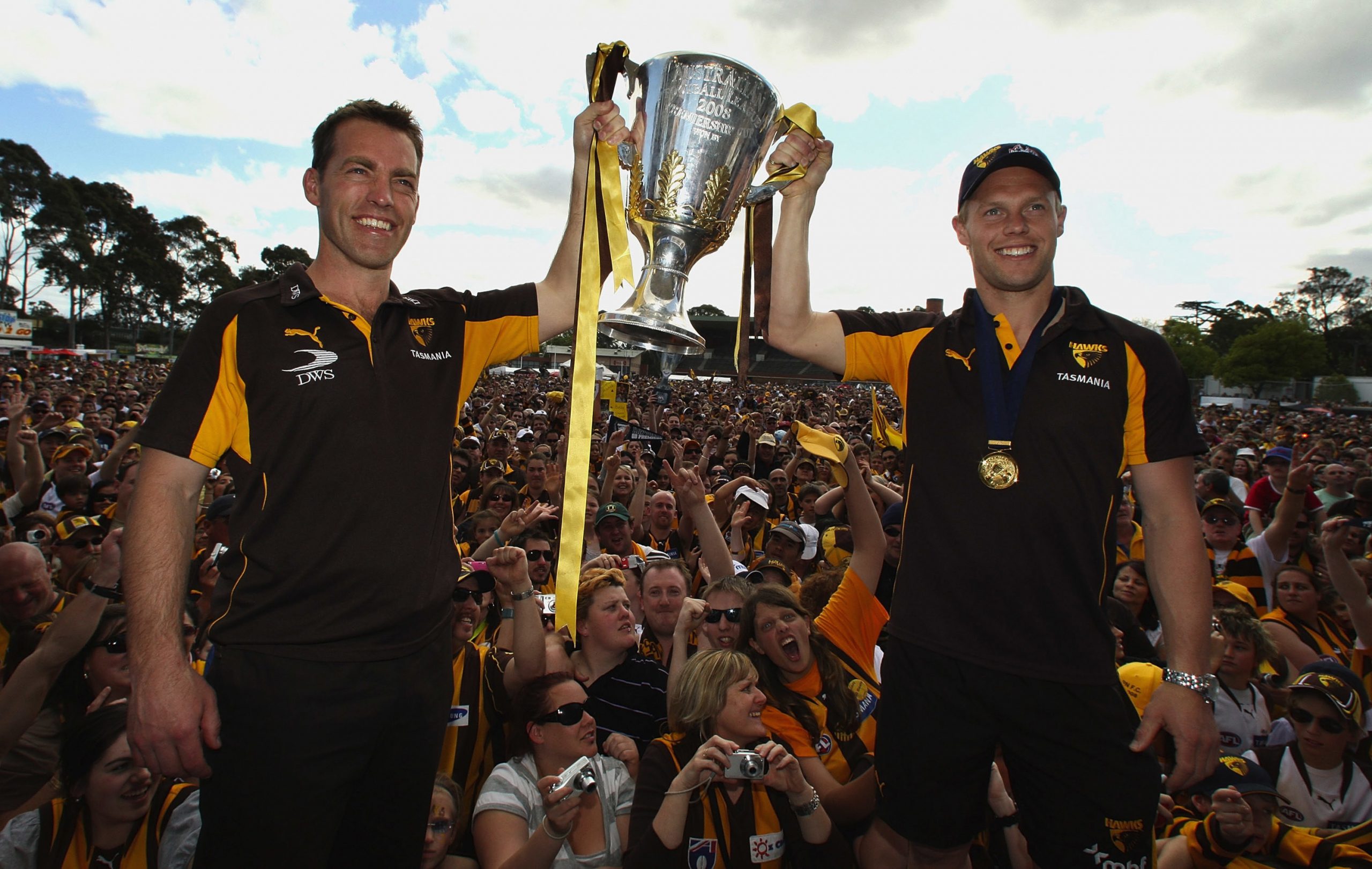 MELBOURNE, AUSTRALIA - SEPTEMBER 28:  Alastair Clarkson coach of the Hawks and Sam Mitchell the captain hold up the 2008 AFL Premiership Cup during the Hawthorn Hawks AFL Grand Final reception at Ausdoc Oval on September 28, 2008 in Melbourne, Australia.  (Photo by Mark Dadswell/Getty Images)