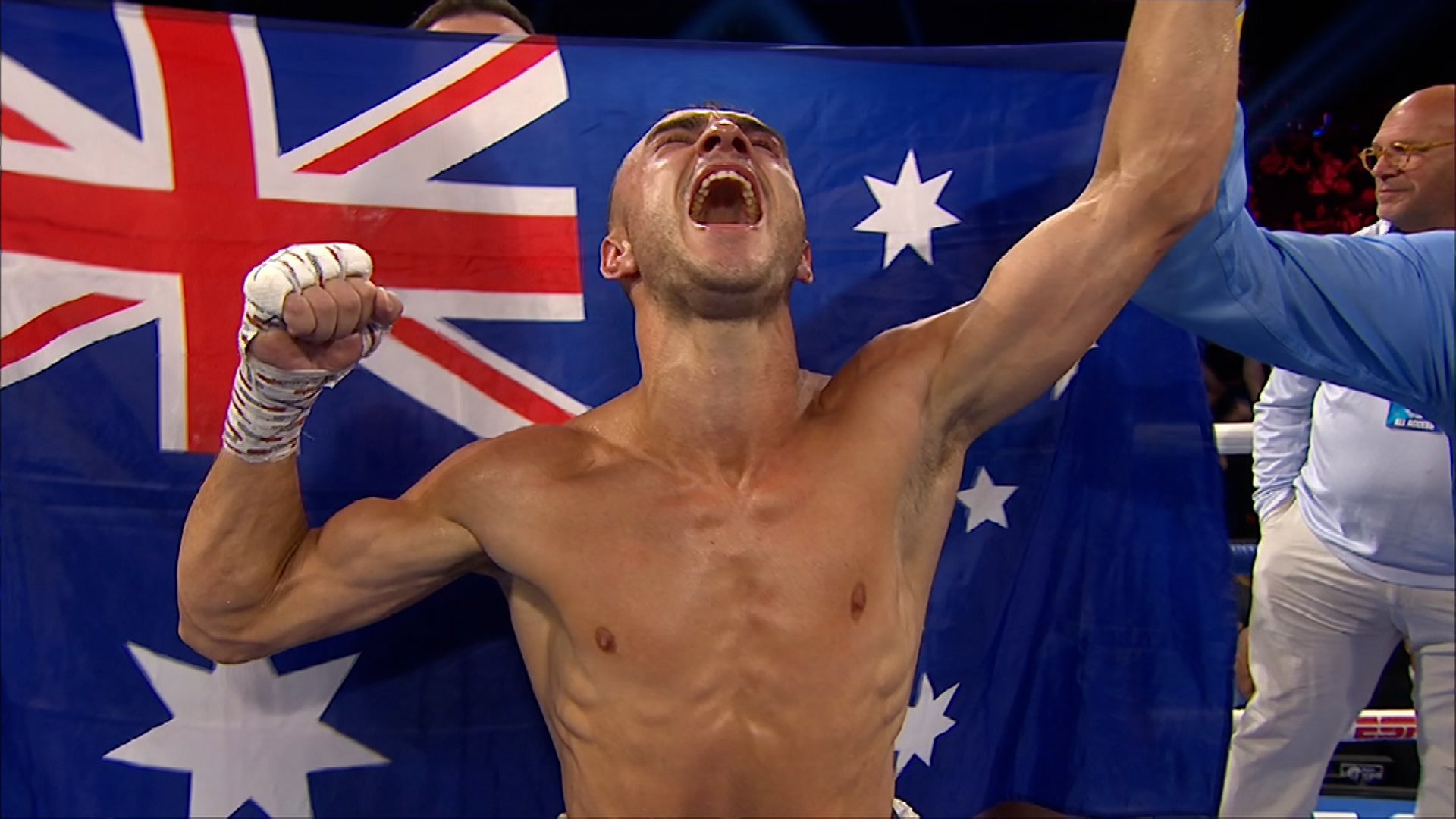 Jason Moloney celebrates becoming a boxing world champion.