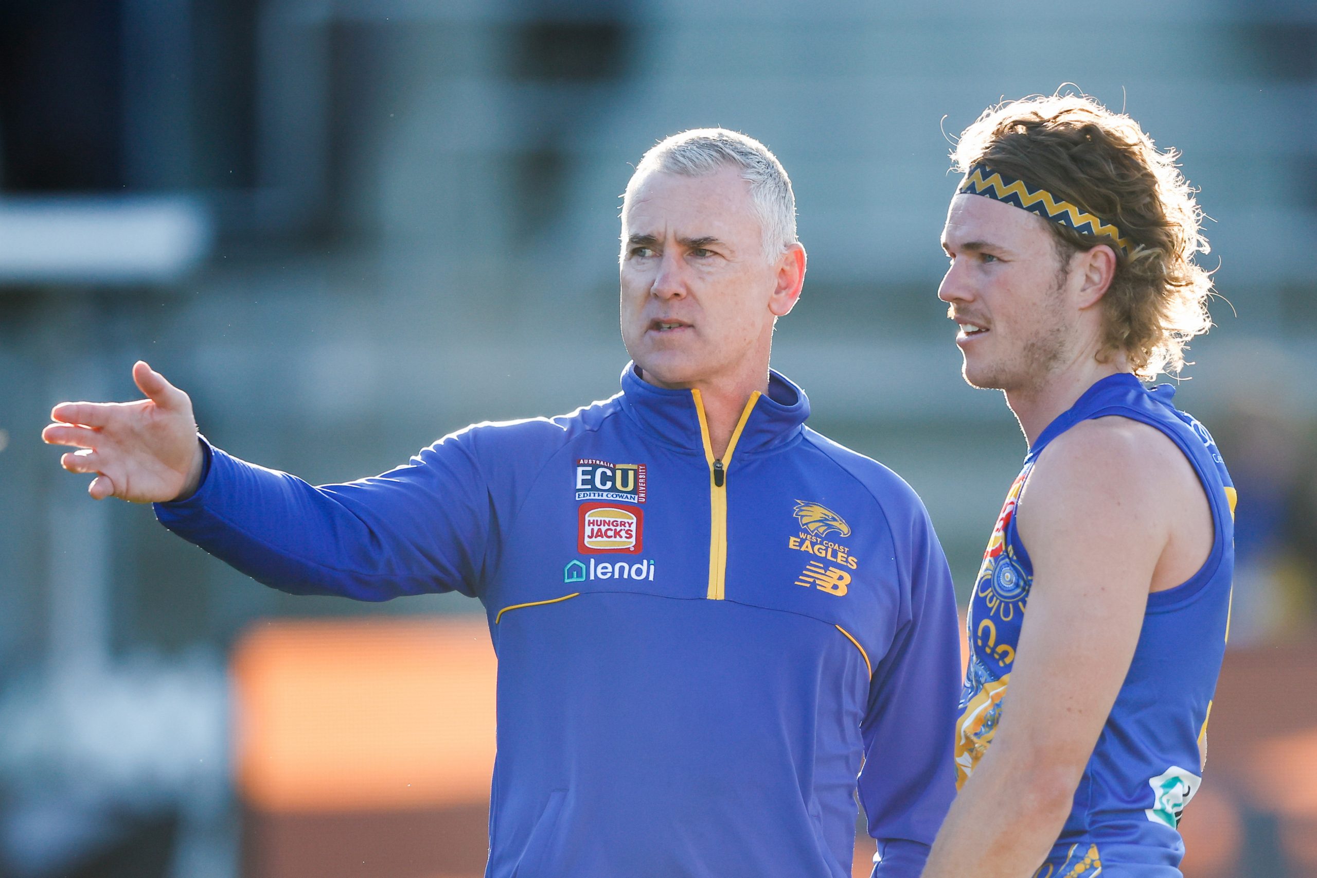 LAUNCESTON, AUSTRALIA - MAY 21: Adam Simpson, Senior Coach of the Eagles chats with Jayden Hunt of the Eagles during the 2023 AFL Round 10 match between the Hawthorn Hawks and the West Coast Eagles at UTAS Stadium on May 21, 2023 in Launceston, Australia. (Photo by Dylan Burns/AFL Photos)