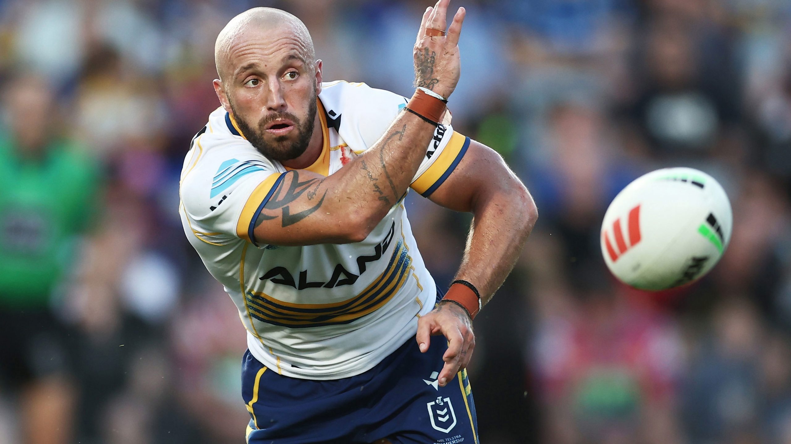 Josh Hodgson of the Eels passes the ball during the club's trial match against the Knights.