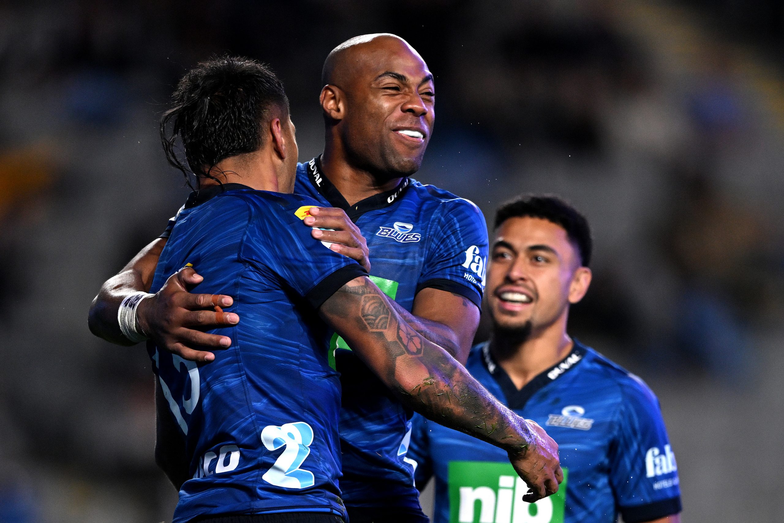 Mark Telea and Rieko Ioane of the Blues celebrate another try.