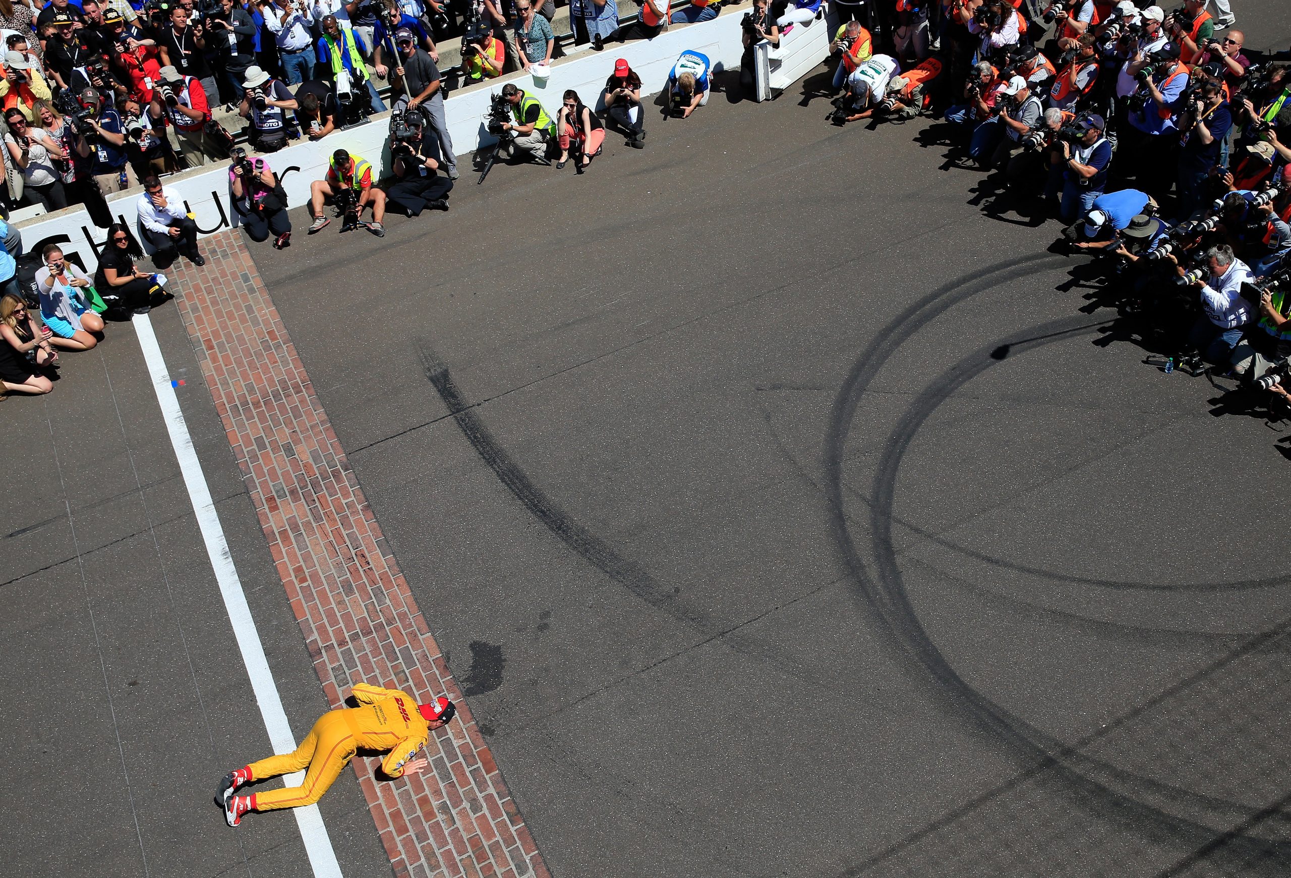 Ryan Hunter-Reay kisses the bricks after winning the 2014 Indianapolis 500.