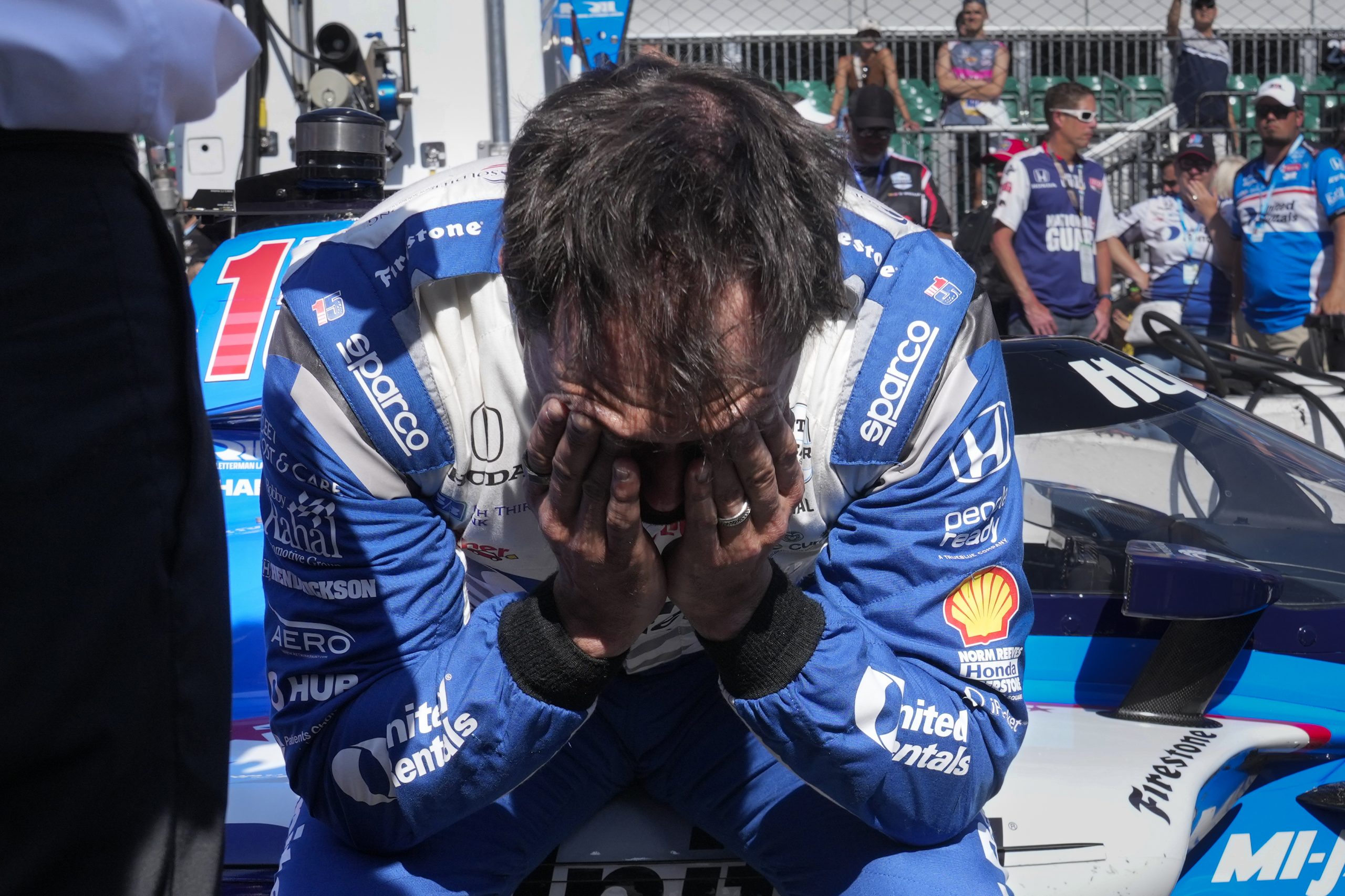 Graham Rahal wipes tears away after getting knocked out of the Indianapolis 500.