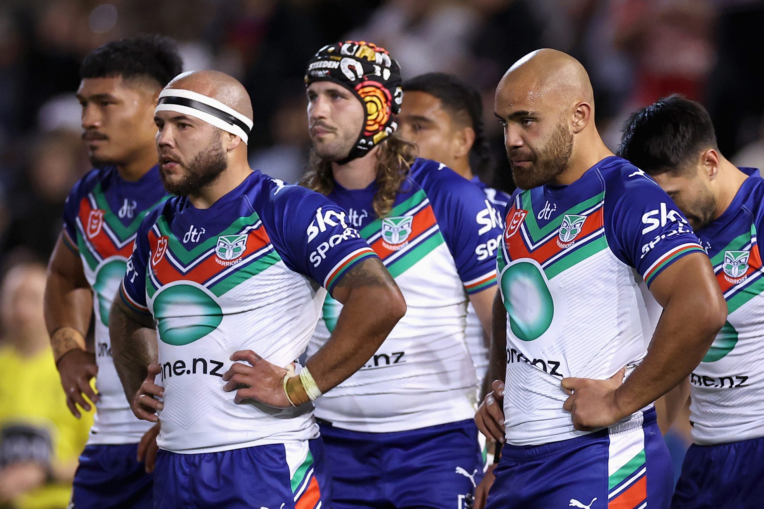 Warriors players look dejected during their round six NRL match with the Knights.
