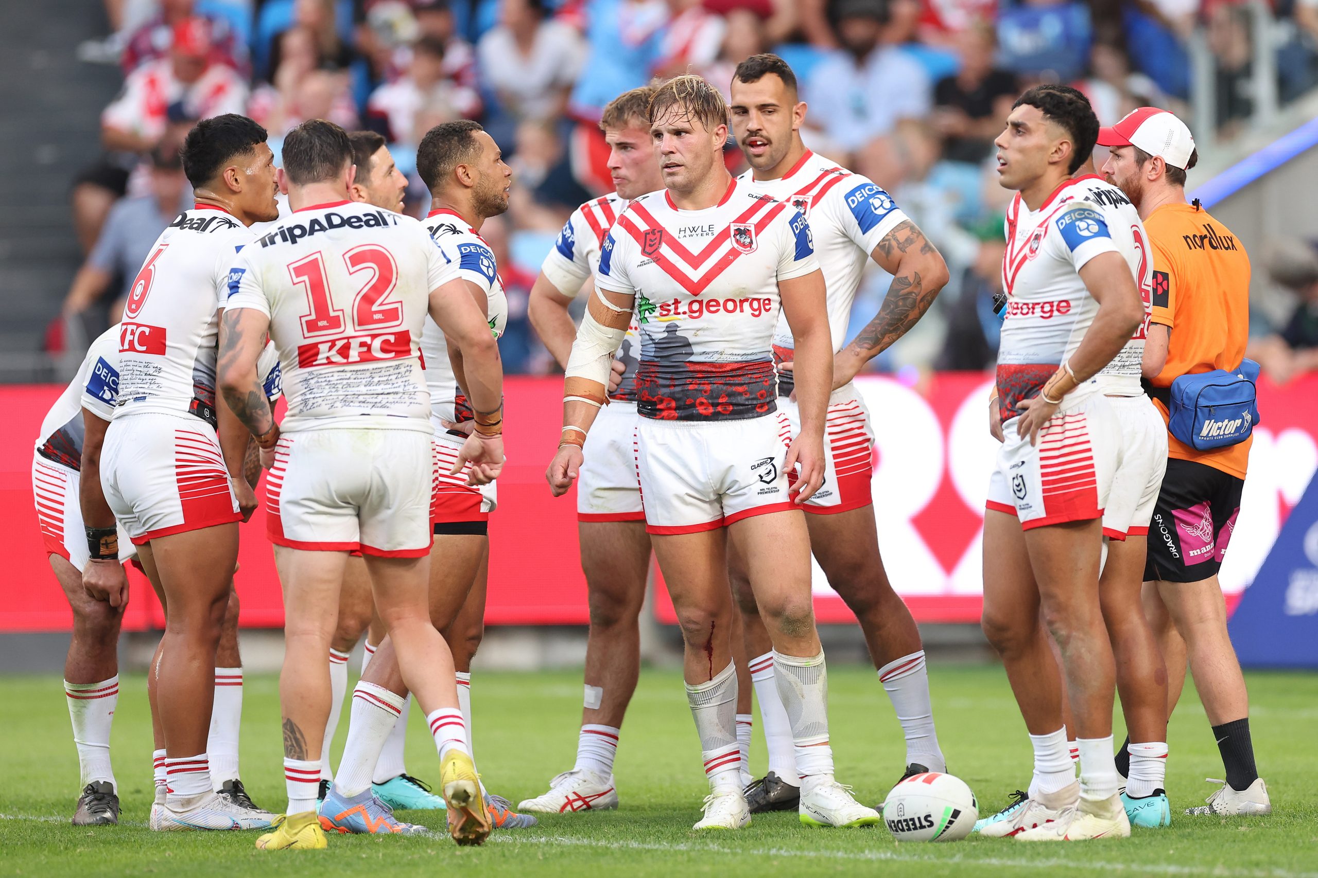 Dragons players look on after an opposition try.