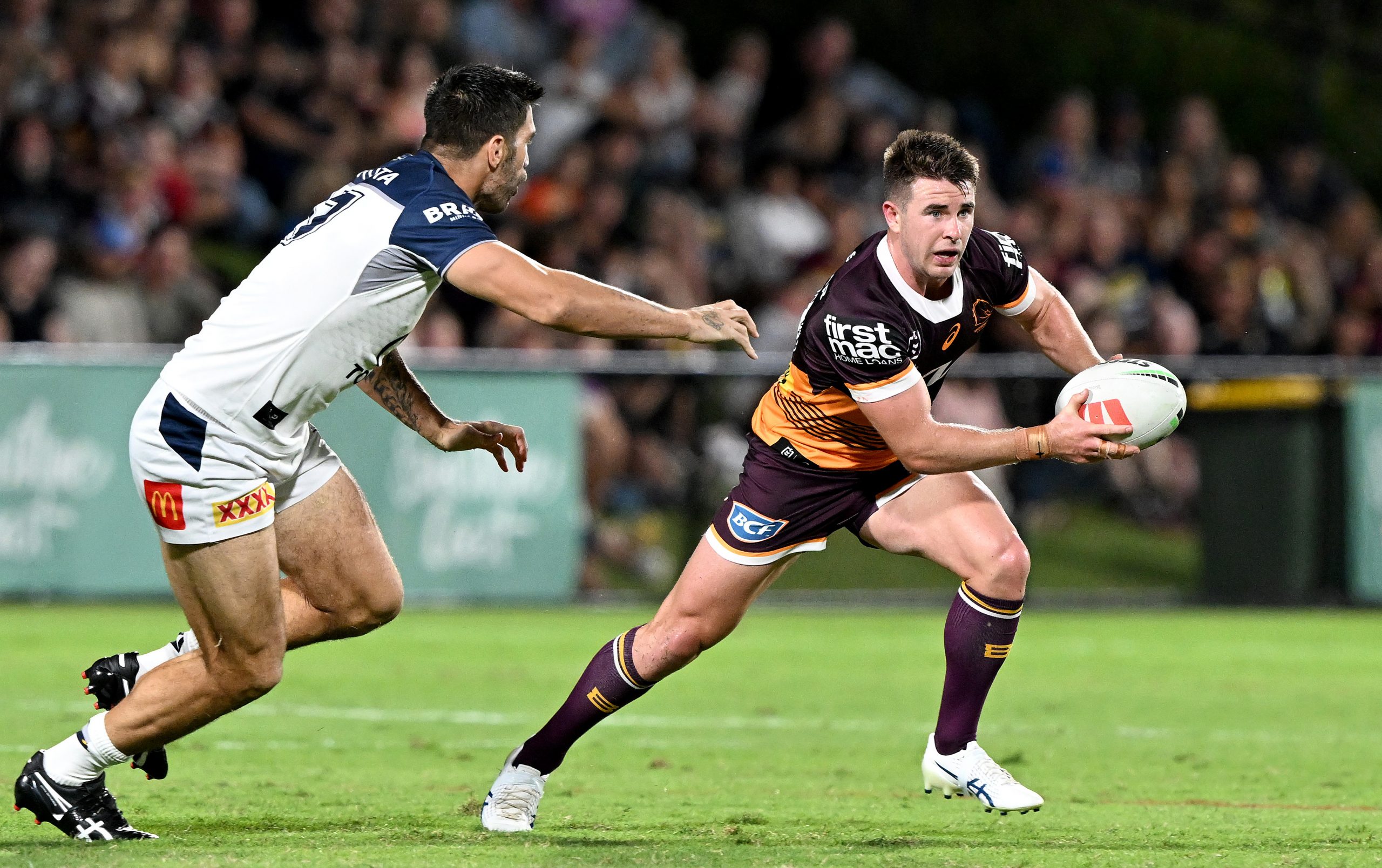 SUNSHINE COAST, AUSTRALIA - FEBRUARY 18: Jock Madden of the Broncos breaks away from the defence during the NRL Trial Match between the Brisbane Broncos and the North Queensland Cowboys at Sunshine Coast Stadium on February 18, 2023 in Sunshine Coast, Australia. (Photo by Bradley Kanaris/Getty Images)