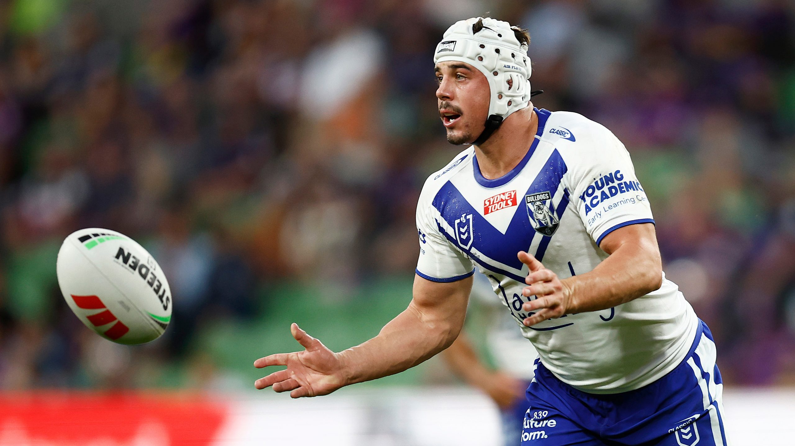 Reed Mahoney of the Bulldogs passes the ball during the round two NRL match between the Melbourne Storm and Canterbury Bulldogs at AAMI Park on March 11, 2023 in Melbourne, Australia. (Photo by Daniel Pockett/Getty Images)