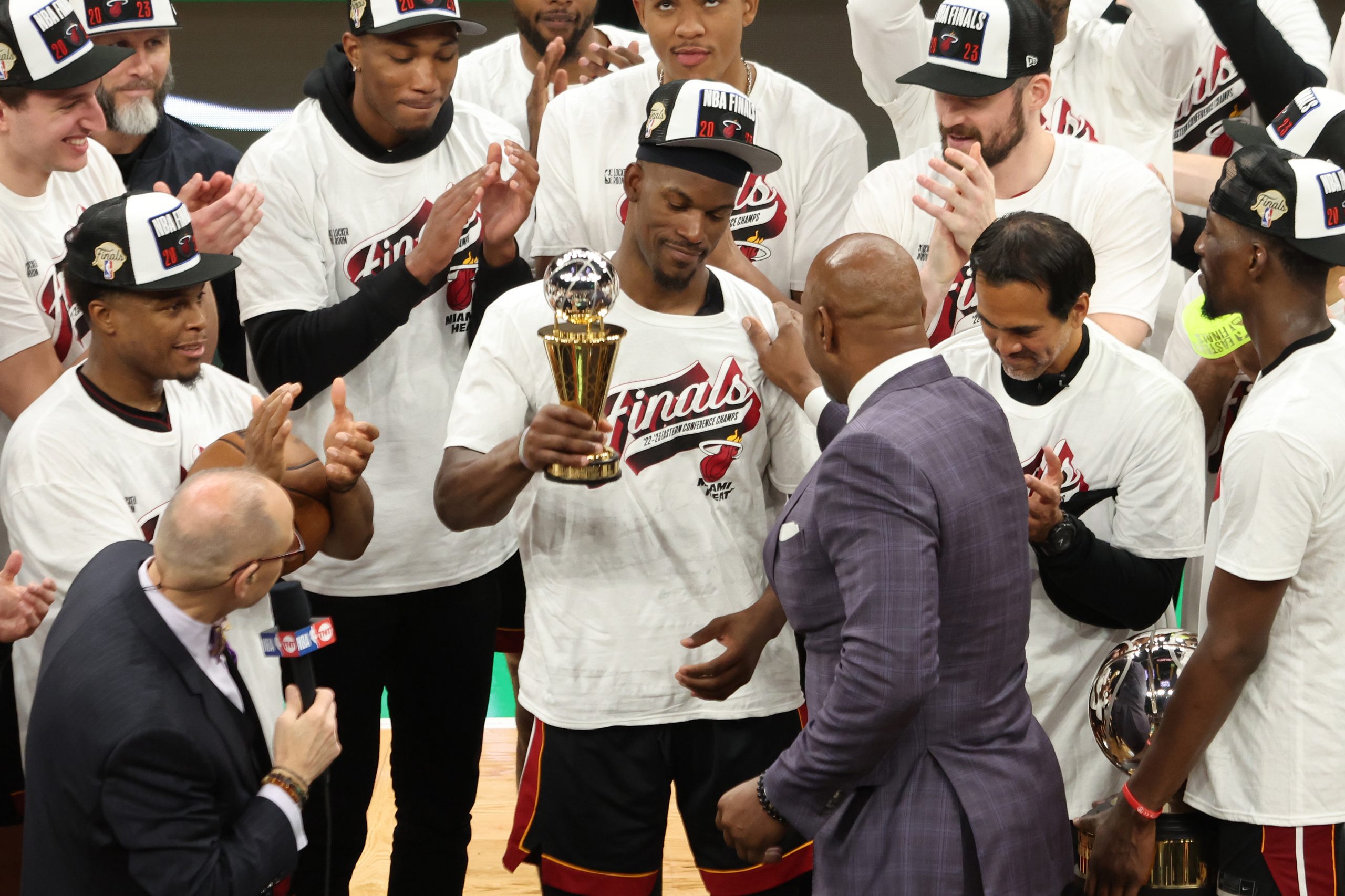 BOSTON, MASSACHUSETTS - MAY 29: Alonzo Mourning presents Jimmy Butler #22 of the Miami Heat with the Larry Bird Trophy after Butler was named the Eastern Conference Finals MVP after defeating the Boston Celtics 103-84 in game seven of the Eastern Conference Finals at TD Garden on May 29, 2023 in Boston, Massachusetts.