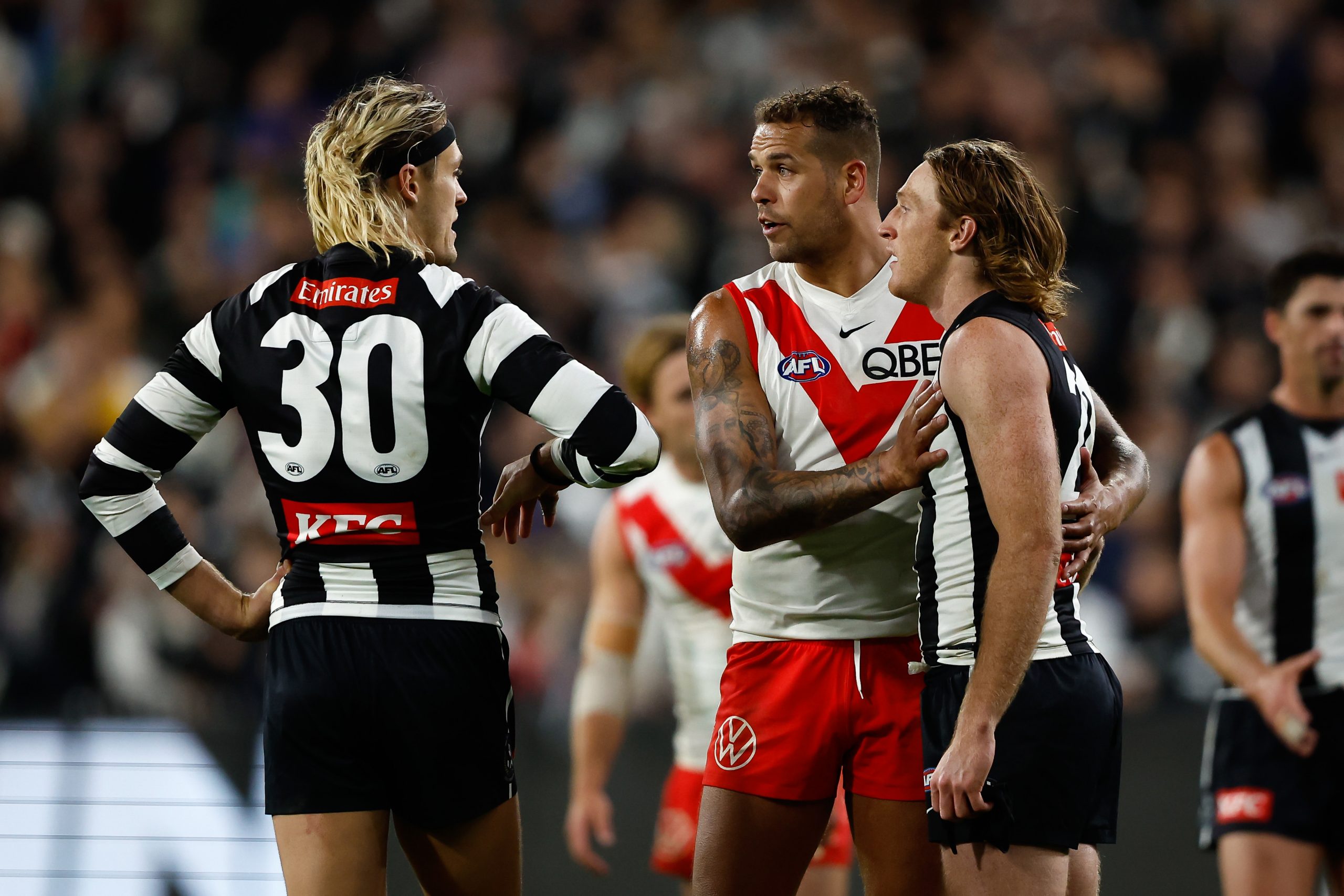 MELBOURNE, AUSTRALIA - MAY 07: Lance Franklin of the Swans and Darcy Moore of the Magpies chat during the 2023 AFL Round 08 match between the Collingwood Magpies and the Sydney Swans at the Melbourne Cricket Ground on May 7, 2023 in Melbourne, Australia. (Photo by Dylan Burns/AFL Photos)