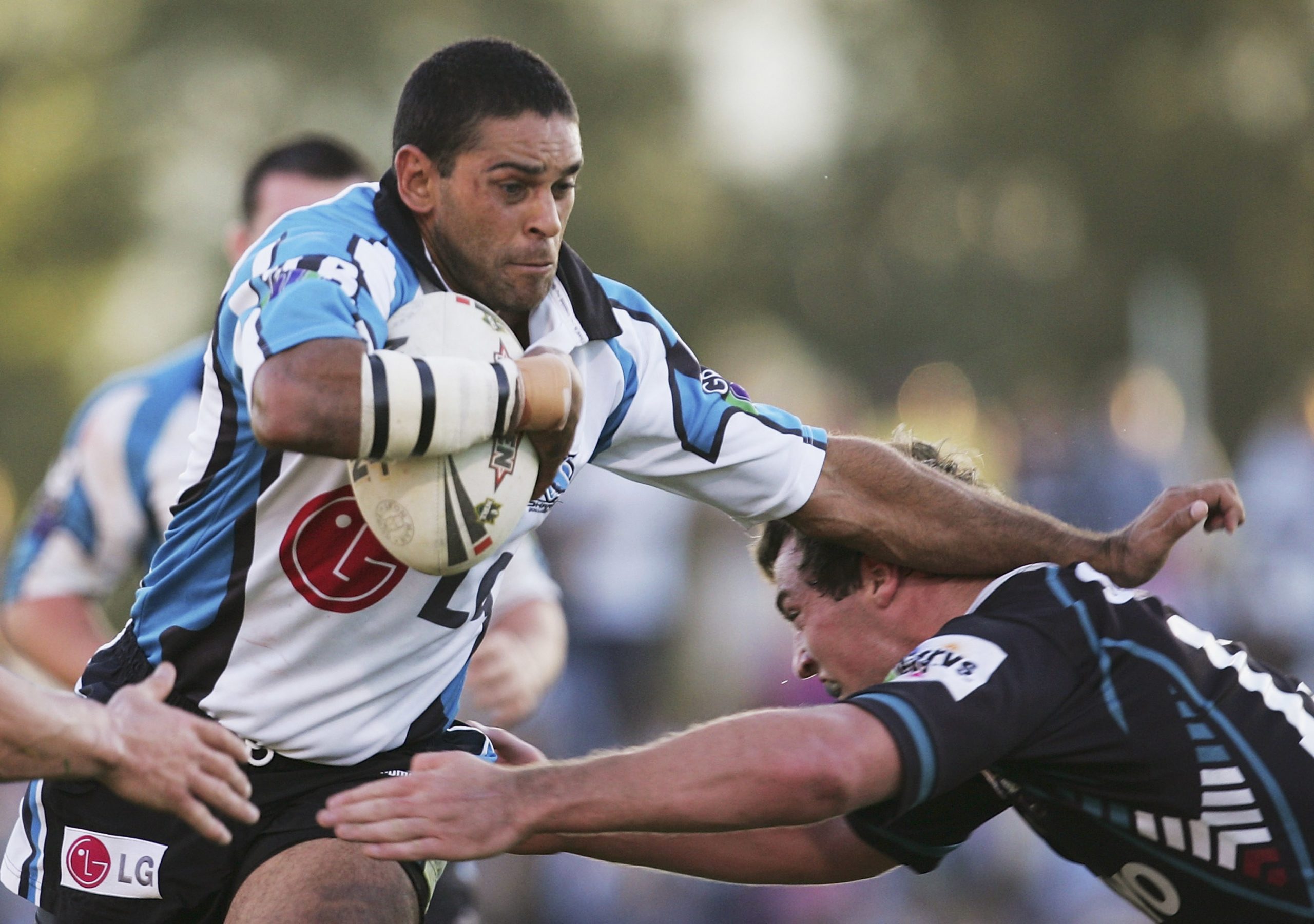 SYDNEY, NSW - MAY 22: David Peachey of the Sharks is tackled during the round 11 NRL match between the Penrith Panthers and the Cronulla-Sutherland Sharks at Penrith Stadium May 22, 2005 in Sydney, Australia. (Photo by Cameron Spencer/Getty Images) *** Local Caption *** David Peachey
