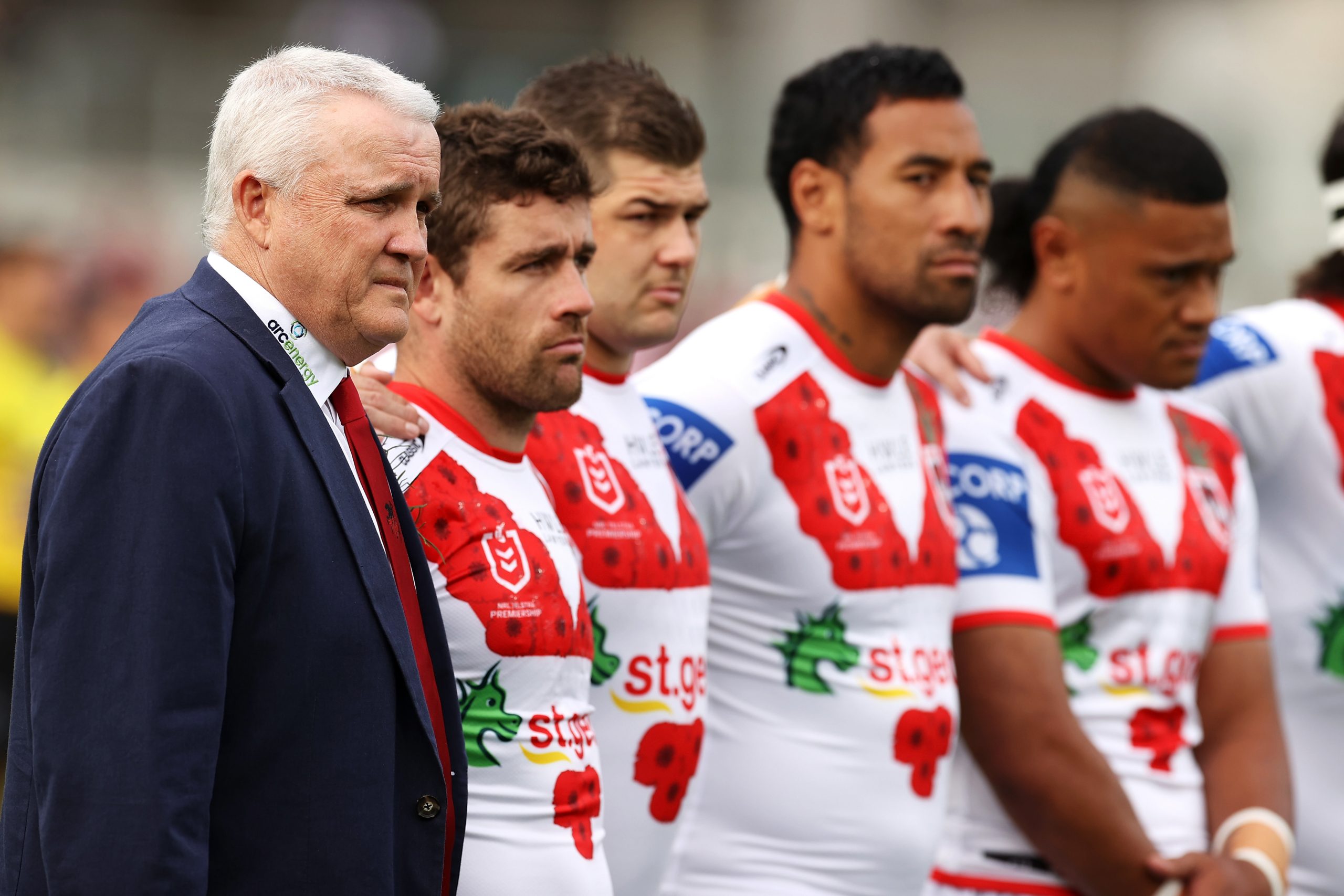 Dragons coach Anthony Griffin stands with the team for the anthems during the Anzac Day ceremony in 2022. (Photo by Mark Kolbe/Getty Images)