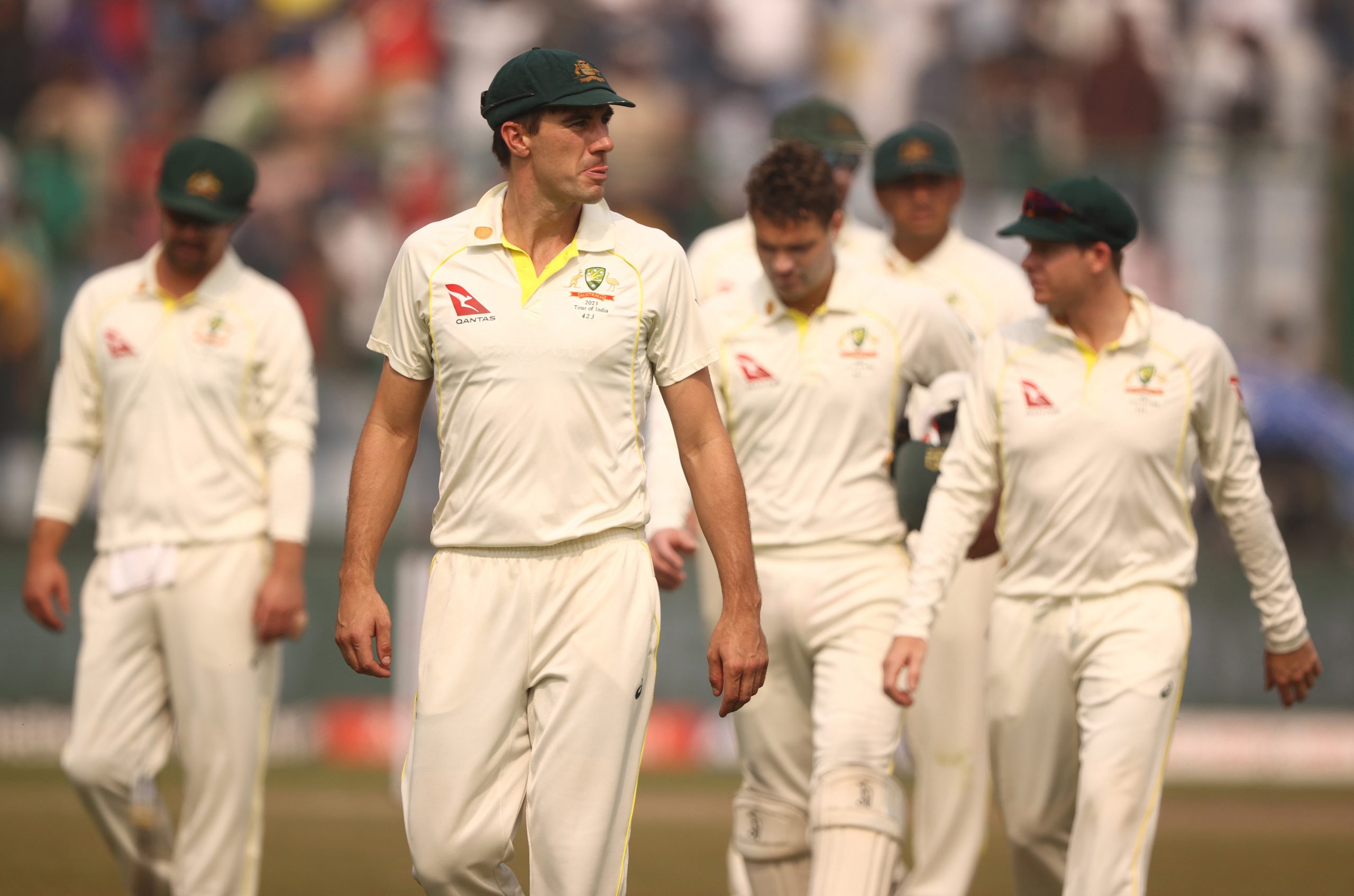 DELHI, INDIA - FEBRUARY 19: Pat Cummins of Australia leads the team off the ground after they were defeated by India during day three of the Second Test match in the series between India and Australia at Arun Jaitley Stadium on February 19, 2023 in Delhi, India. (Photo by Robert Cianflone/Getty Images)