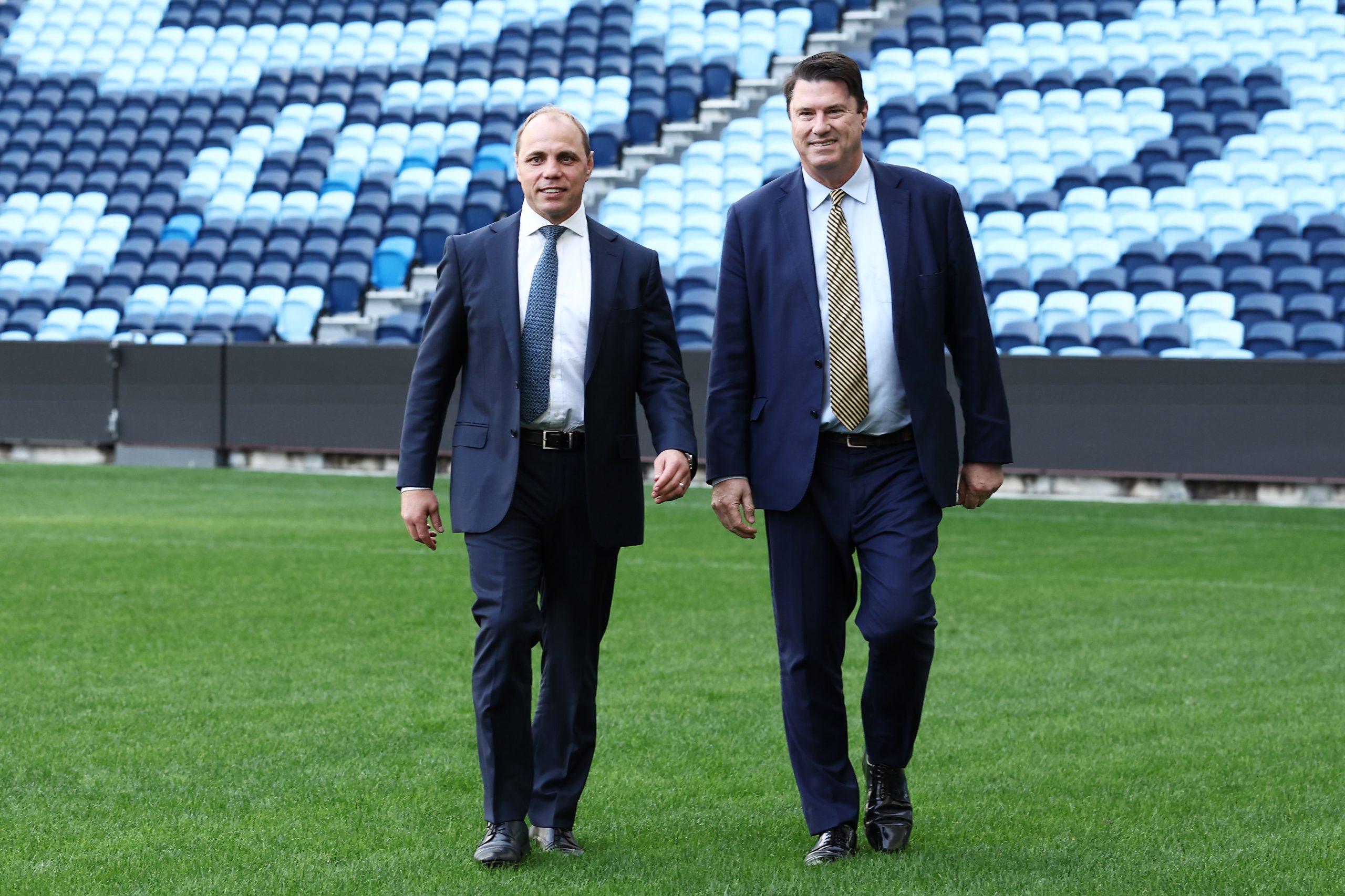 Rugby Australia CEO Phil Waugh walks next to chairman Hamish McLennan.