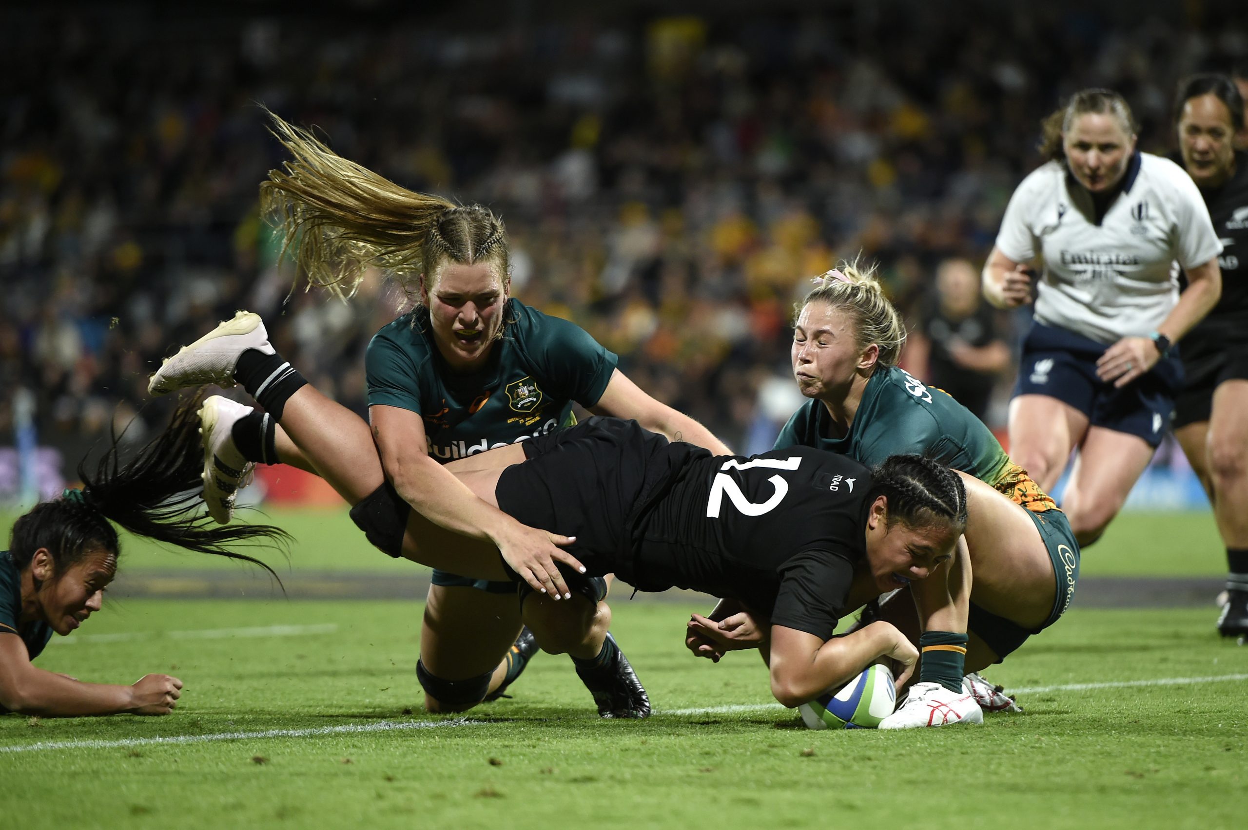 Sylvia Brunt of New Zealand scores a try in Brisbane.