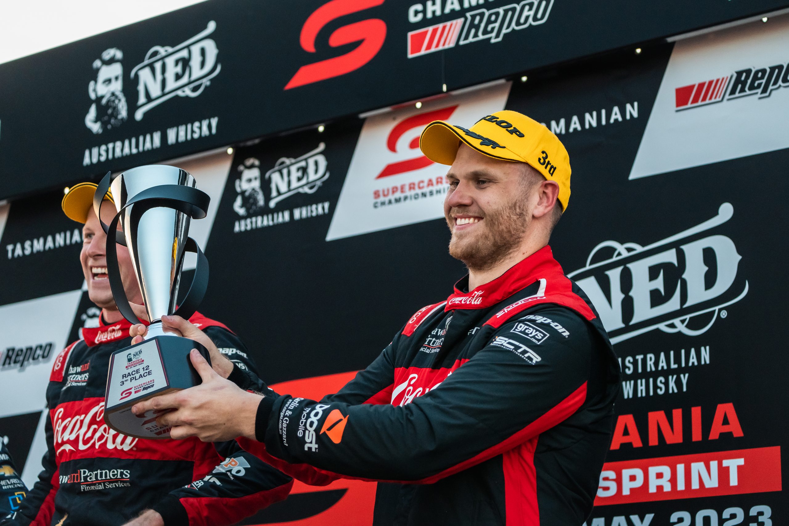 Brodie Kostecki celebrates a podium at Symmons Plains.