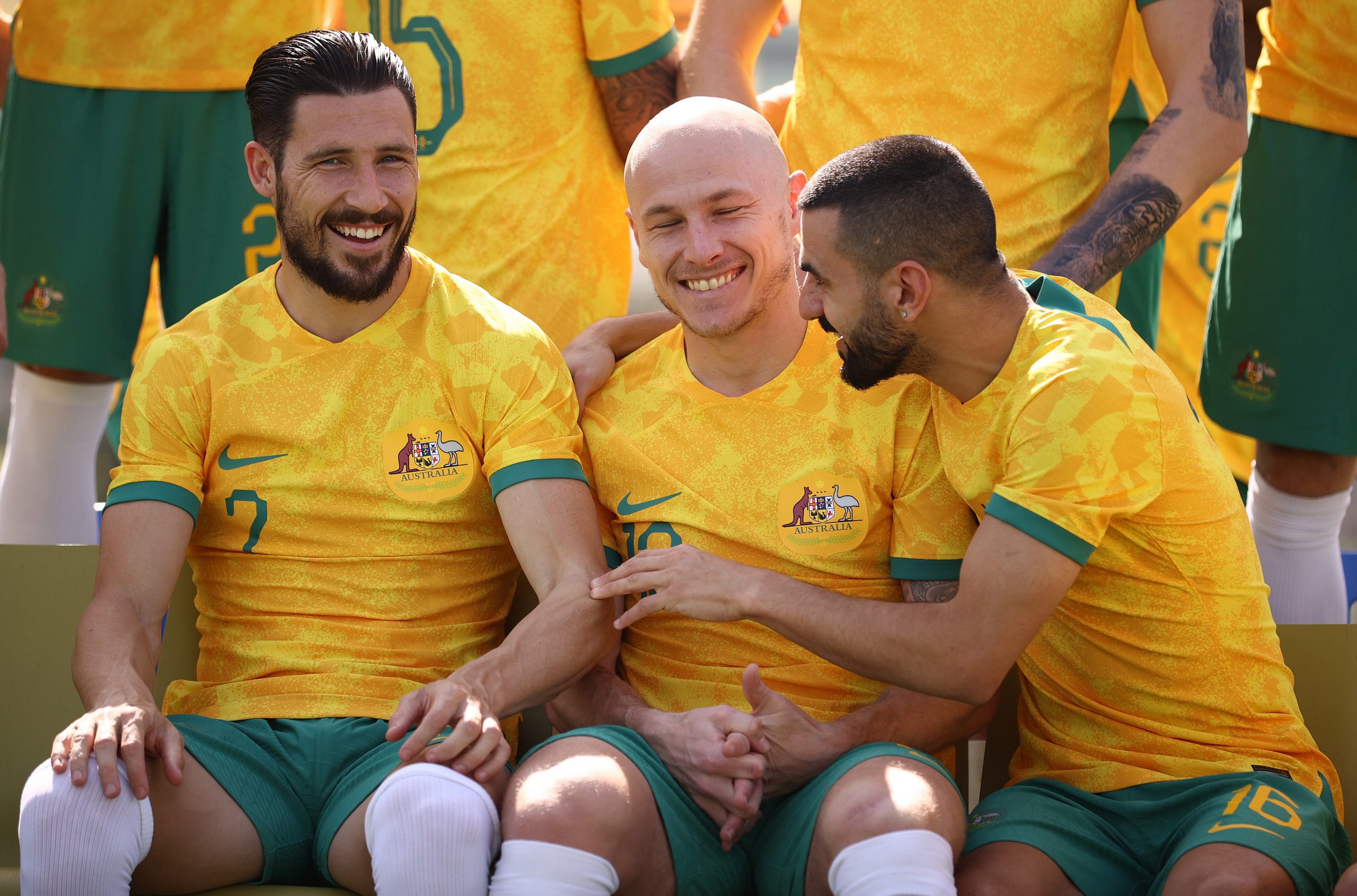 Mathew Leckie, Aaron Mooy and Aziz Behich pose during Australia's official World Cup team photo.