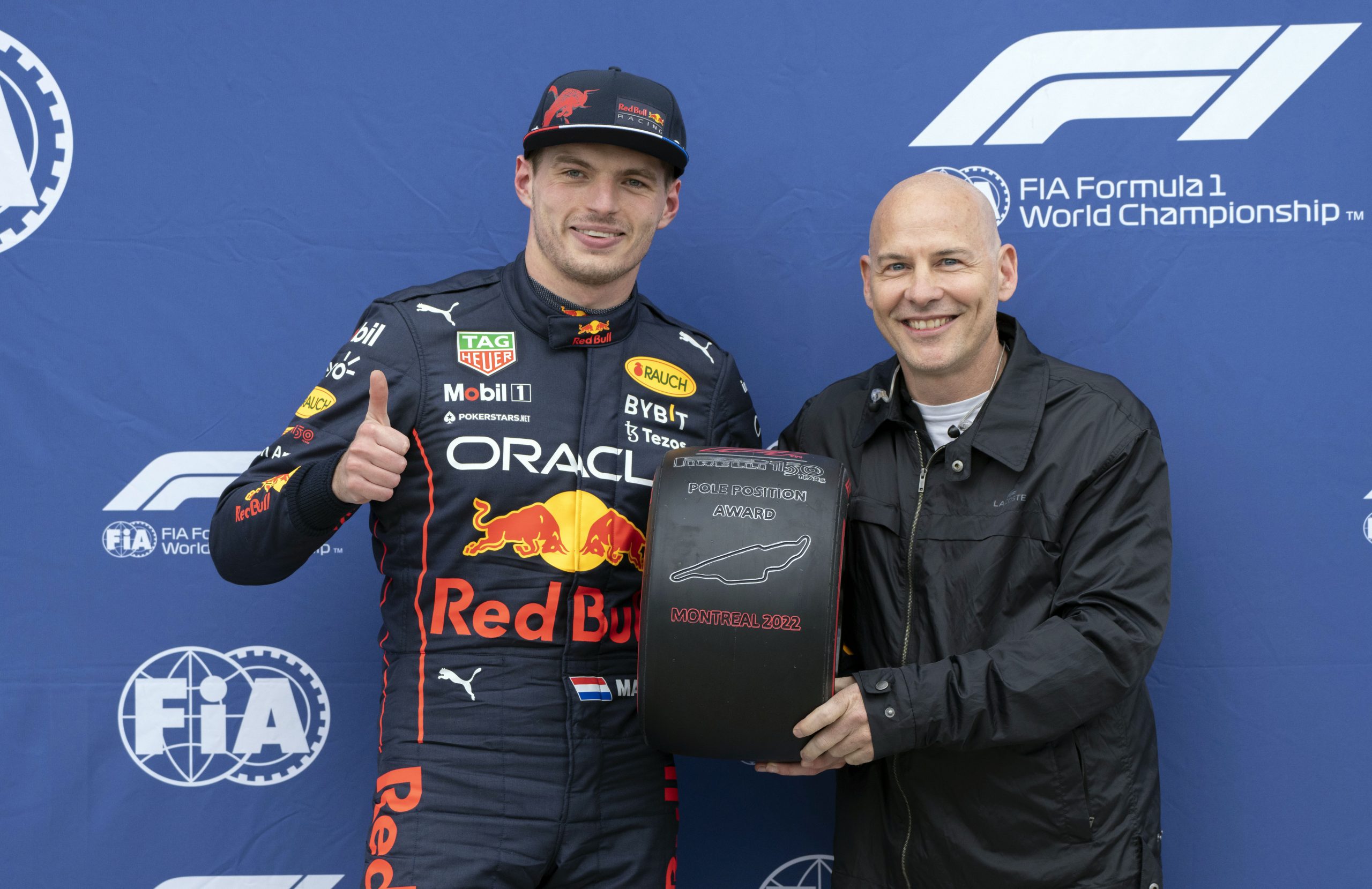 Jacques Villeneuve (right) presents Max Verstappen with the pole position award at the 2022 Canadian Grand Prix.