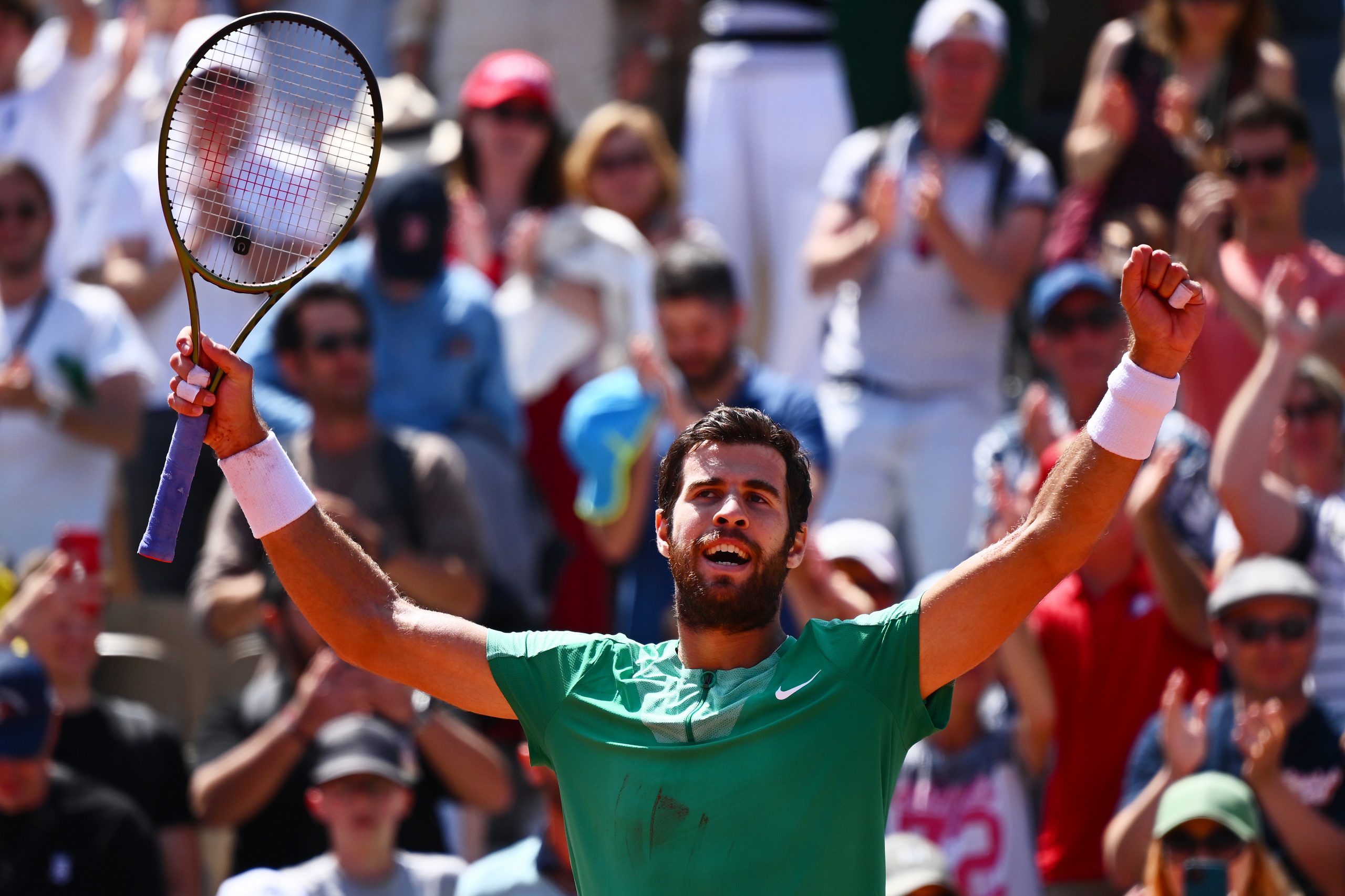 Karen Khachanov celebrates winning match point against Thanasi Kokkinakis of Australia.