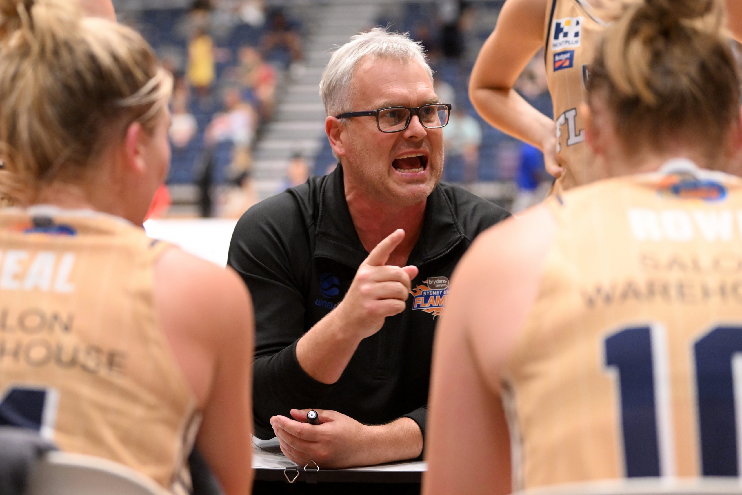 Sydney Flames head coach Shane Heal talks to players. (Photo by Morgan Hancock/Getty Images)