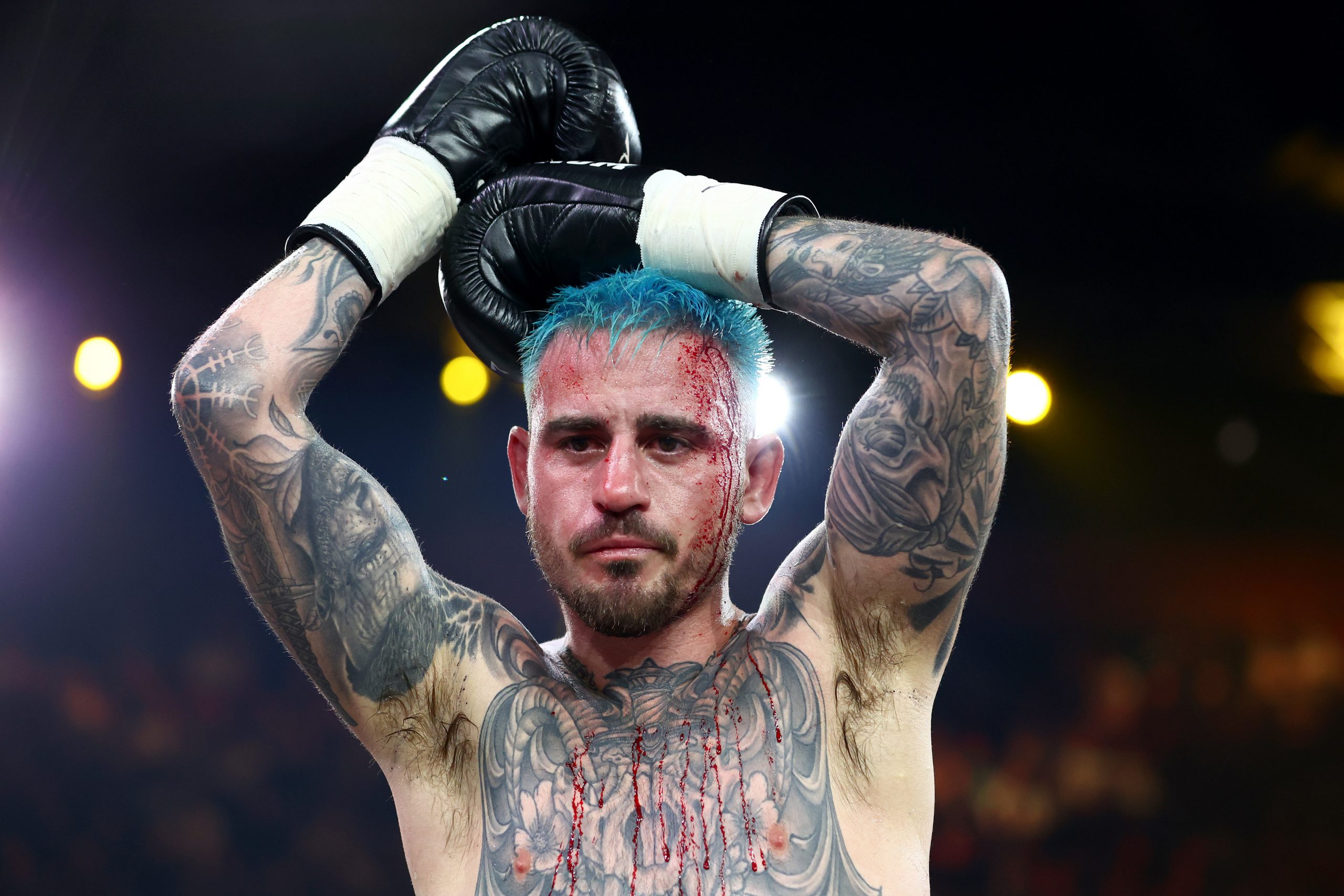 Justin Frost with blood draped all over him following the fight with Hassan Hamdan