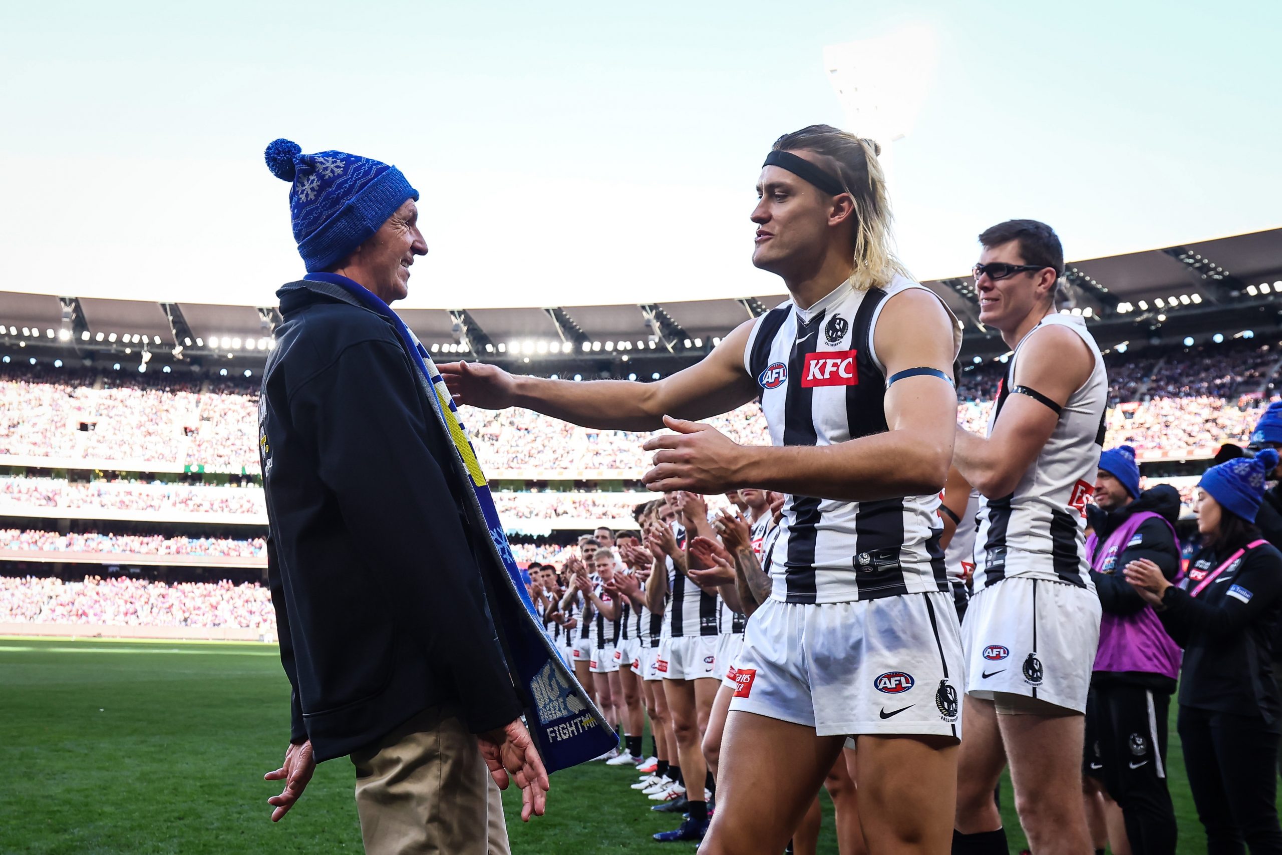 MELBOURNE, AUSTRALIA - JUNE 12: Neale Daniher is seen with Darcy Moore of the Magpies during the 2023 AFL Round 13 match between the Melbourne Demons and the Collingwood Magpies at the Melbourne Cricket Ground on June 12, 2023 in Melbourne, Australia. (Photo by Dylan Burns/AFL Photos via Getty Images)