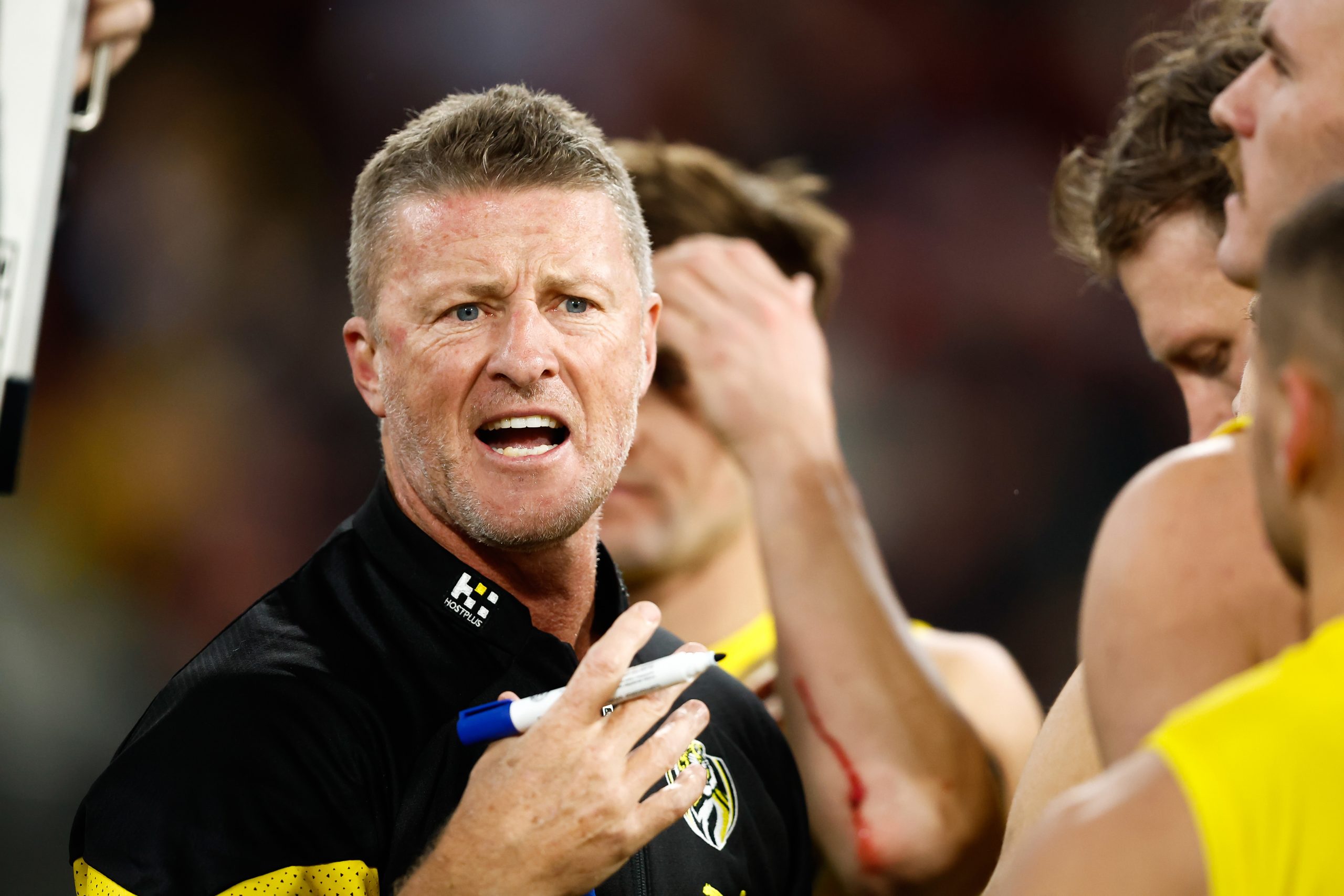MELBOURNE, AUSTRALIA - MAY 20: Damien Hardwick, Senior Coach of the Tigers addresses his players during the 2023 AFL Round 10 match between the Essendon Bombers and the Richmond Tigers at the Melbourne Cricket Ground on May 20, 2023 in Melbourne, Australia. (Photo by Dylan Burns/AFL Photos)