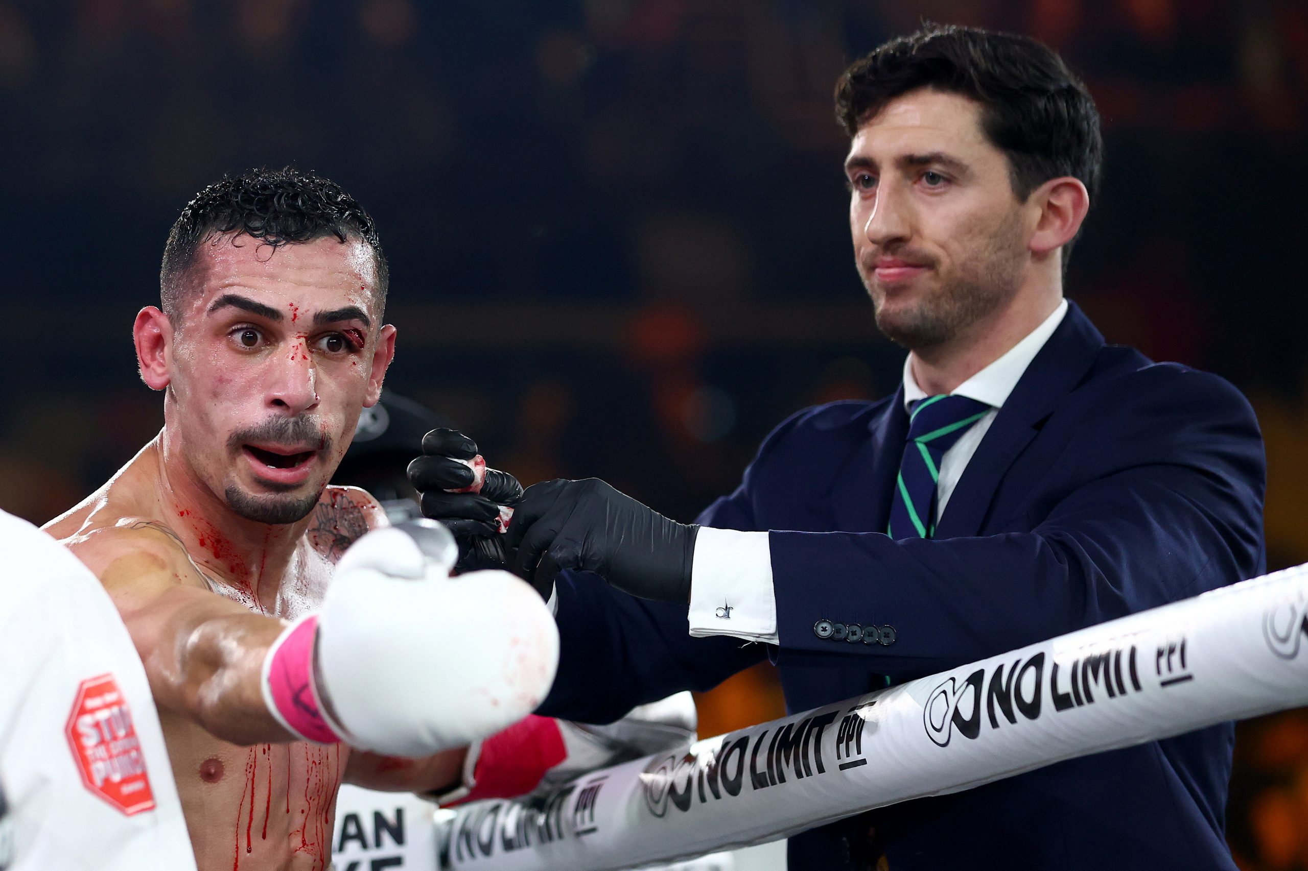 Hassan Hamdan looks towards Jeff Fenech for guidance after the doctor's decision to call the fight off