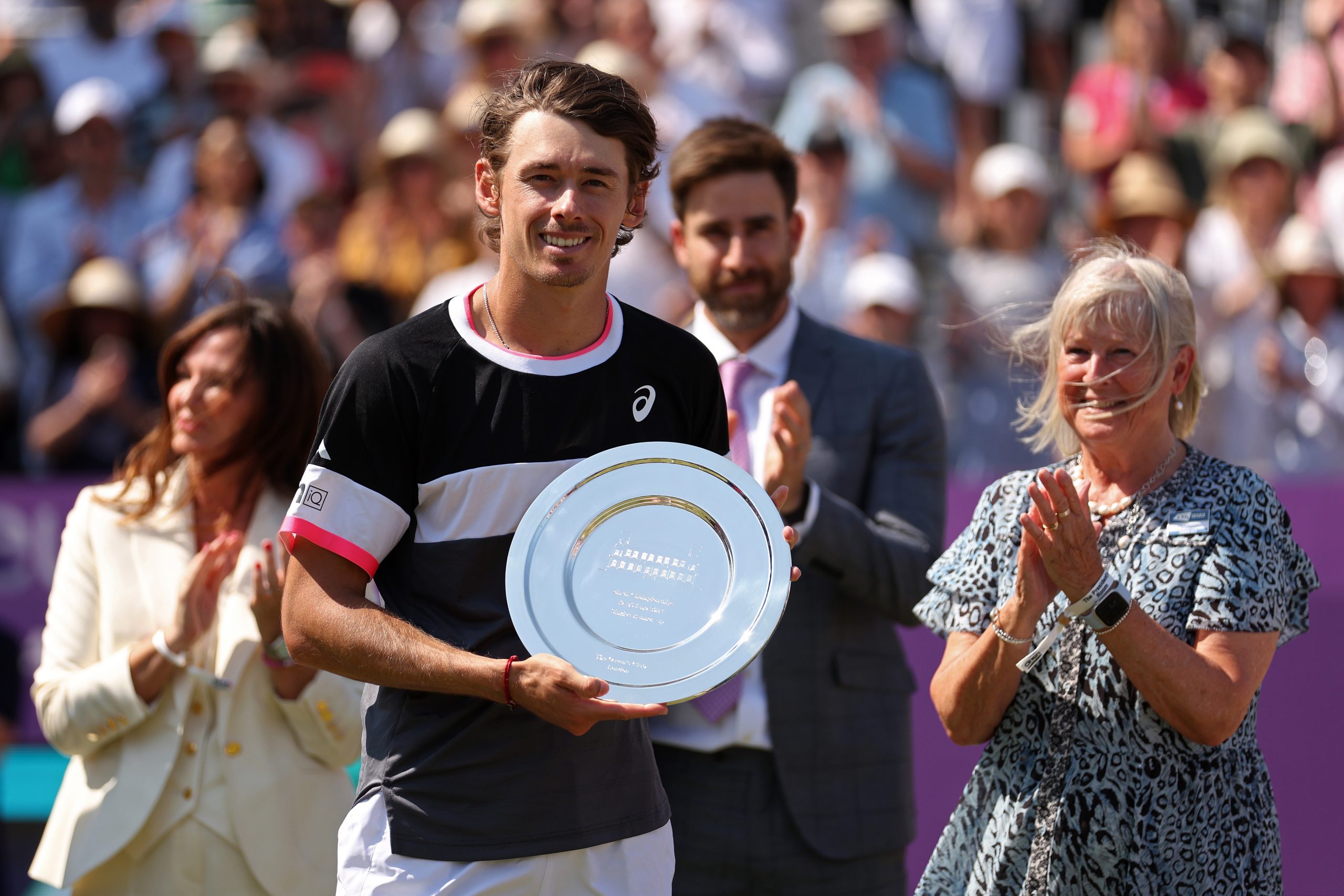 Alex De Minaur of Australia poses with his runners-up trophy after defeat to Carlos Alcaraz of Spain at The Queen's Club.