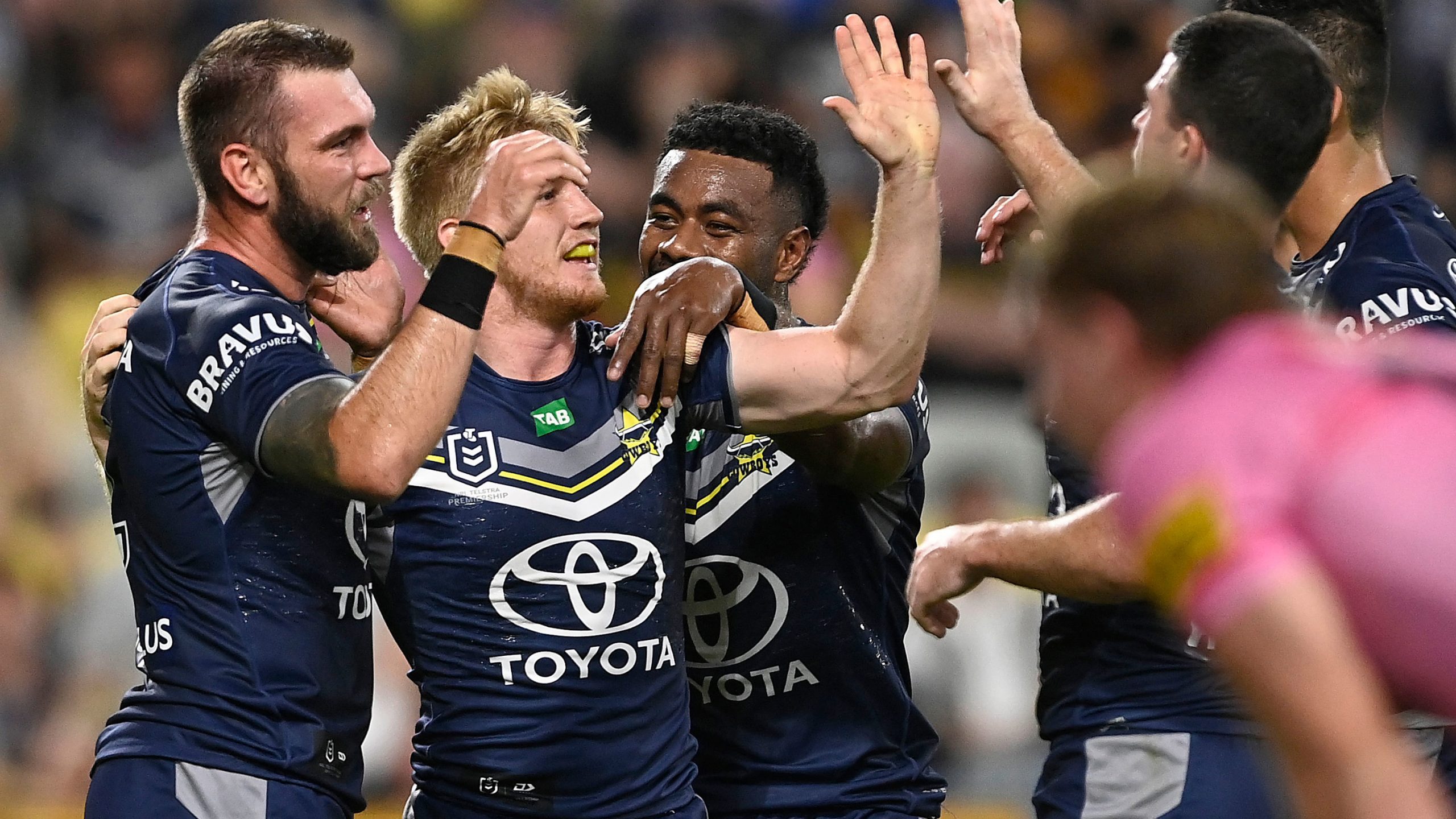 Tom Dearden celebrates after scoring a try for the Cowboys in their round 16 match against the Panthers.